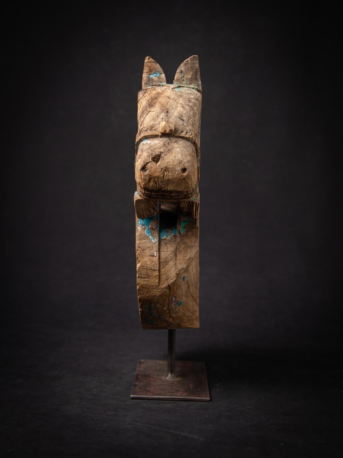 Discover the elegance of this antique wooden temple fragment, featuring a finely carved horse head from 18th-century India. Crafted from solid wood, this exquisite artifact stands 44 cm high, 10 cm wide, and 29 cm deep, with a weight of 4.51 kgs.