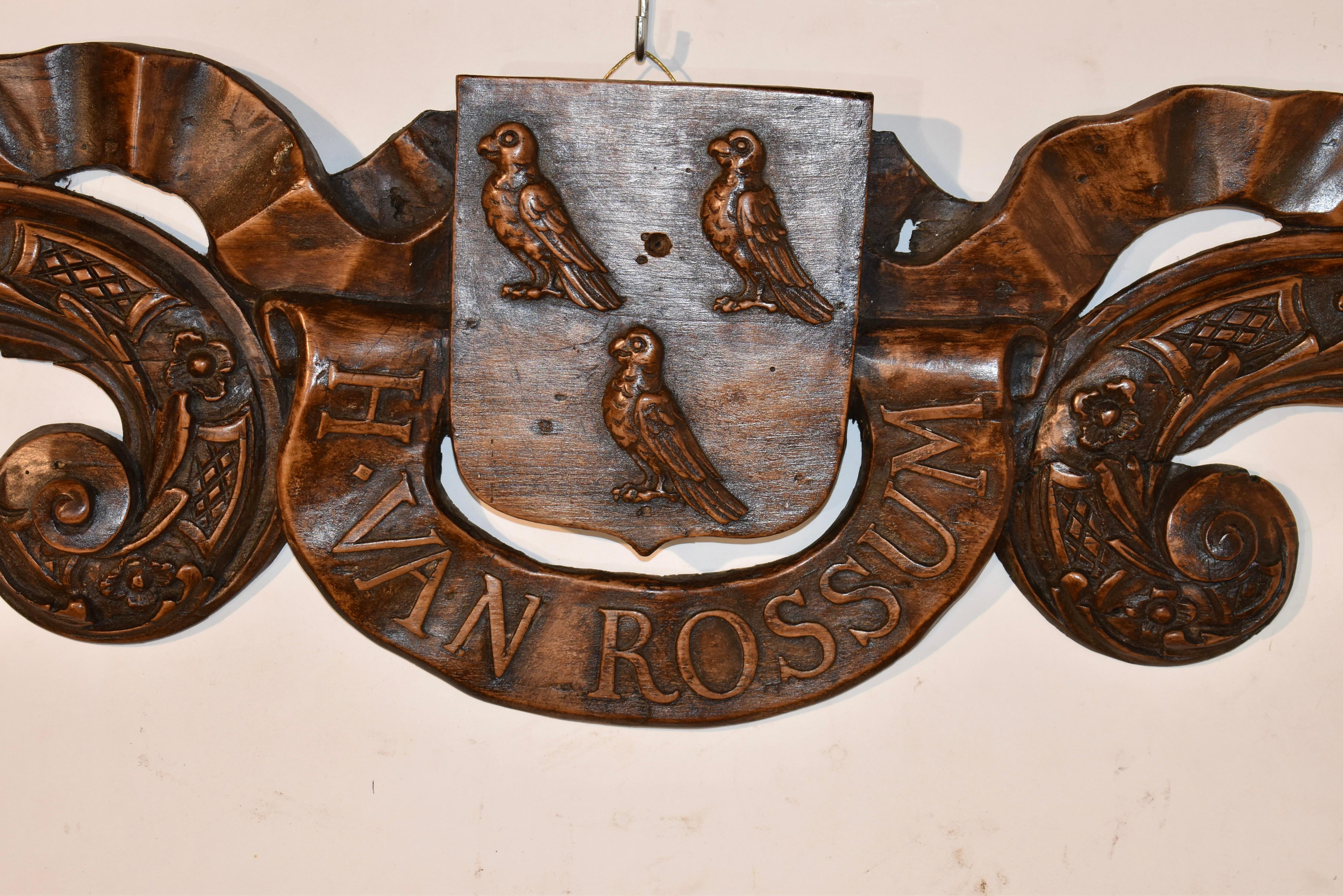 Part of a set of hand carved door surround that was from an 18th century house in the Netherlands.  The other part of the set is dated 1728.  The piece has carved moldings incorporated with carved ribbons including the family name of H. Van Rossum