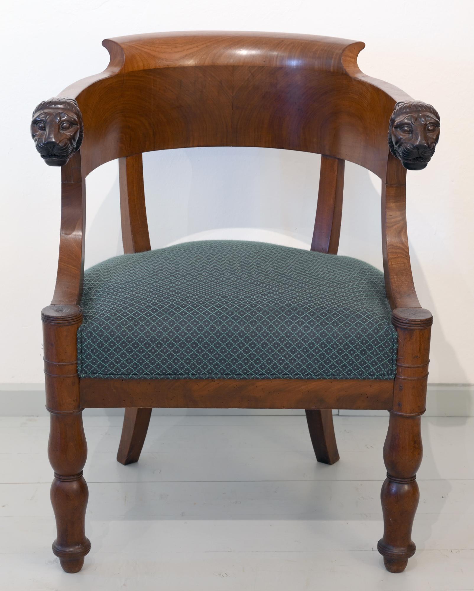 Very charming armchair which was made, circa 1795 in France out of very beautiful grained massive mahogany. The lion heads are worked out very fine. It is very confident to sit in this special chair.
The chair is perfect for using as office or desk