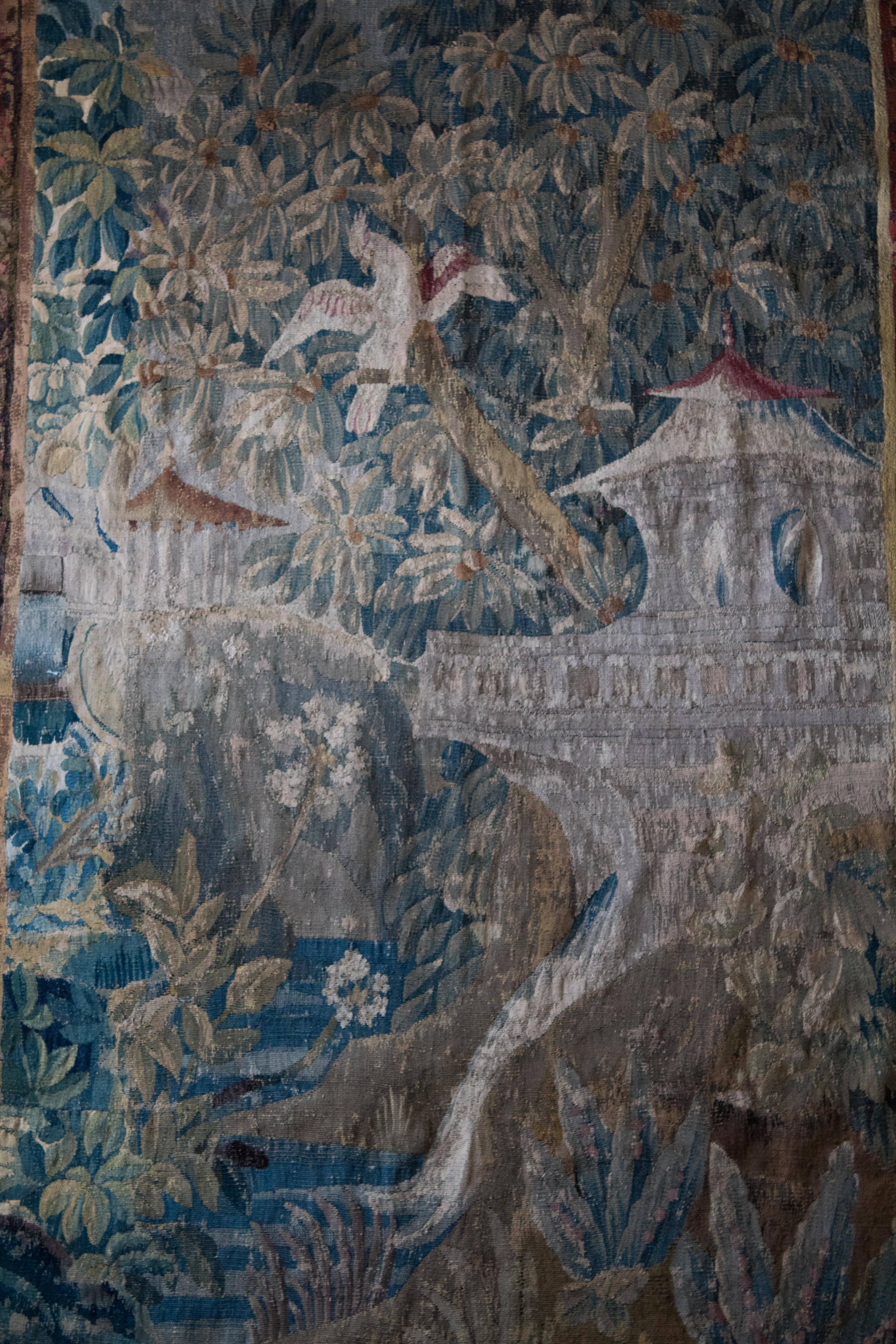 Artist Jean Baptiste Pillement (French 1728-1808) was very influential in spreading the taste for Chinoiseries throughout Europe.
This Aubusson tapestry after a cartoon by Pillement is made of silk and wool and shows a Chinese pagode surrounded by