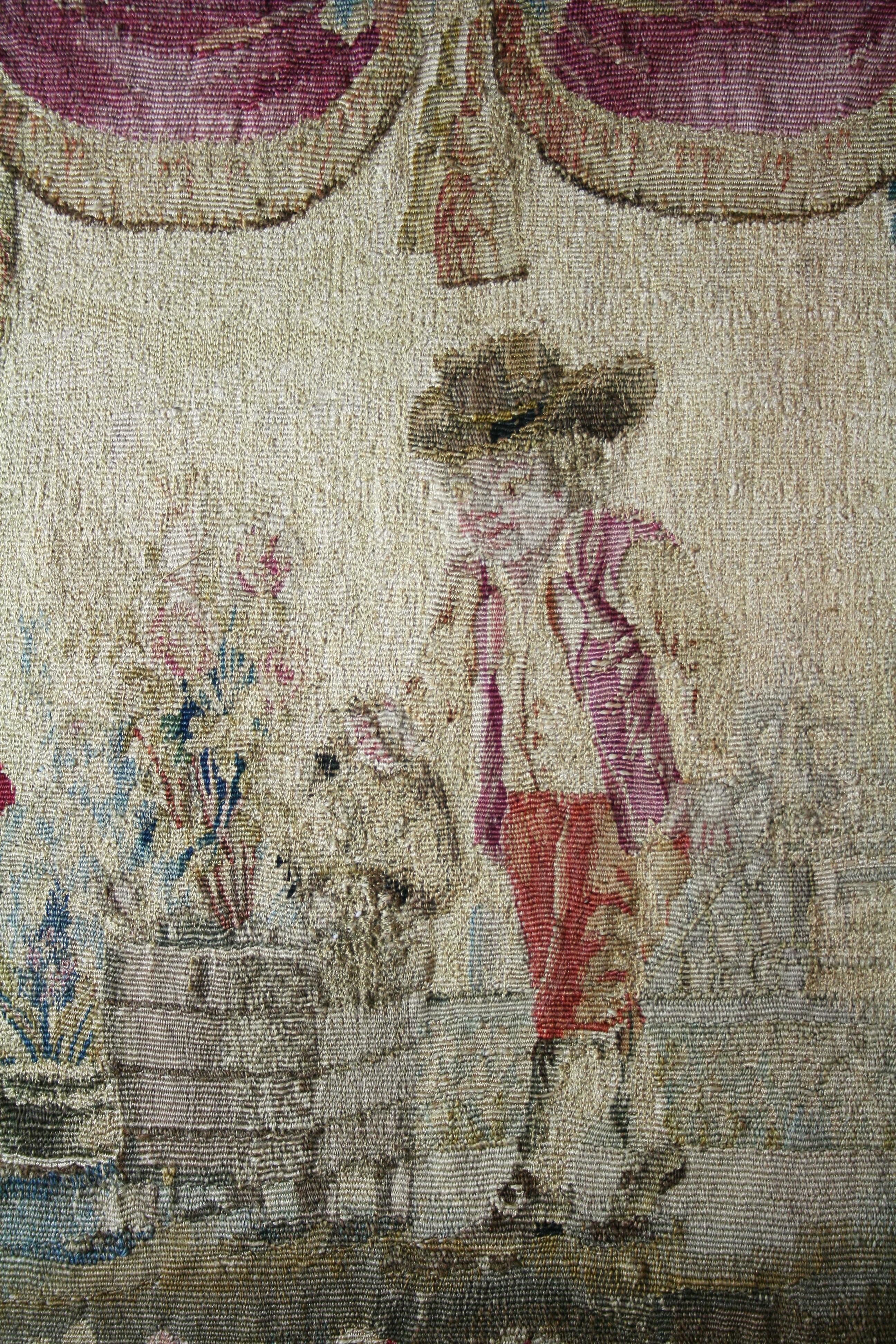 Charming Aubusson tapestry representing a small gardener watering plants in a jardinière.
Aubusson is a town in central France where tapestry workshops were installed which had their peak in the 17th and 18th century,
France,
Second half of the