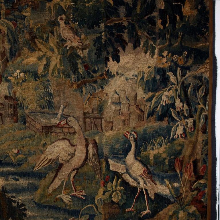 Authentic 18th century large Aubusson Tapestry from Paris. C. 1780. This hand-woven tapestry has a rich palette of greens and blues and muted browns and features trees and foliage and birds. Would work wonderfully behind a bed for an elegant rich