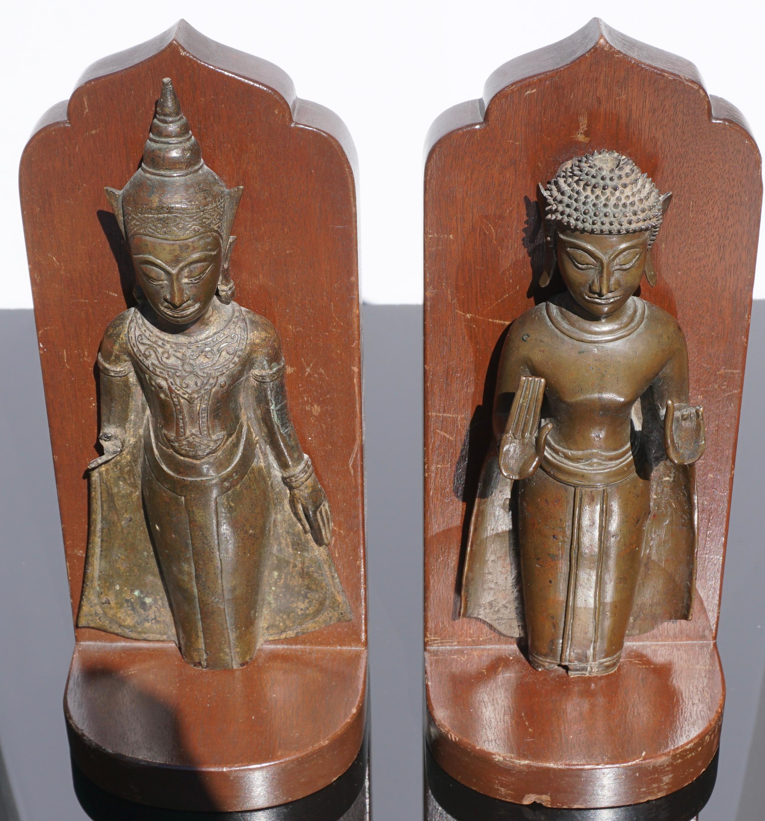 Extremely decorative; these authentic 18th century or earlier Ayutthaya period Thai bronze Buddhas were fashioned into bookends due to their losses of appendages and legs. Very detailed quality casts!

Measures: Height 11 inches (each)
Width 4.75
