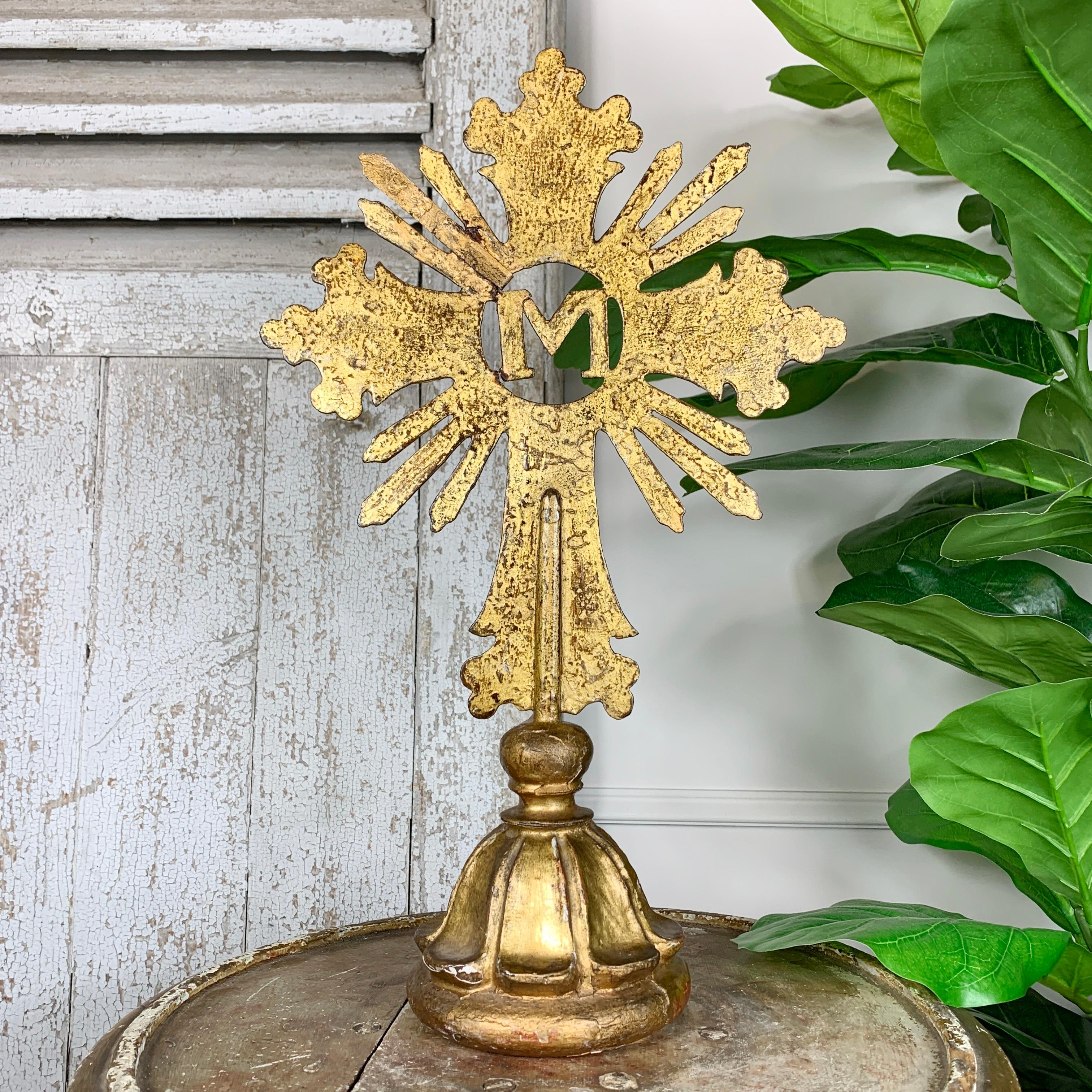 A superb 18th century German baroque altar cross on original gilt wooden base. This marian cross bears the M to the centre, denoting the presence of the Virgin Mary would have been placed on the altar and used during ceremonies and