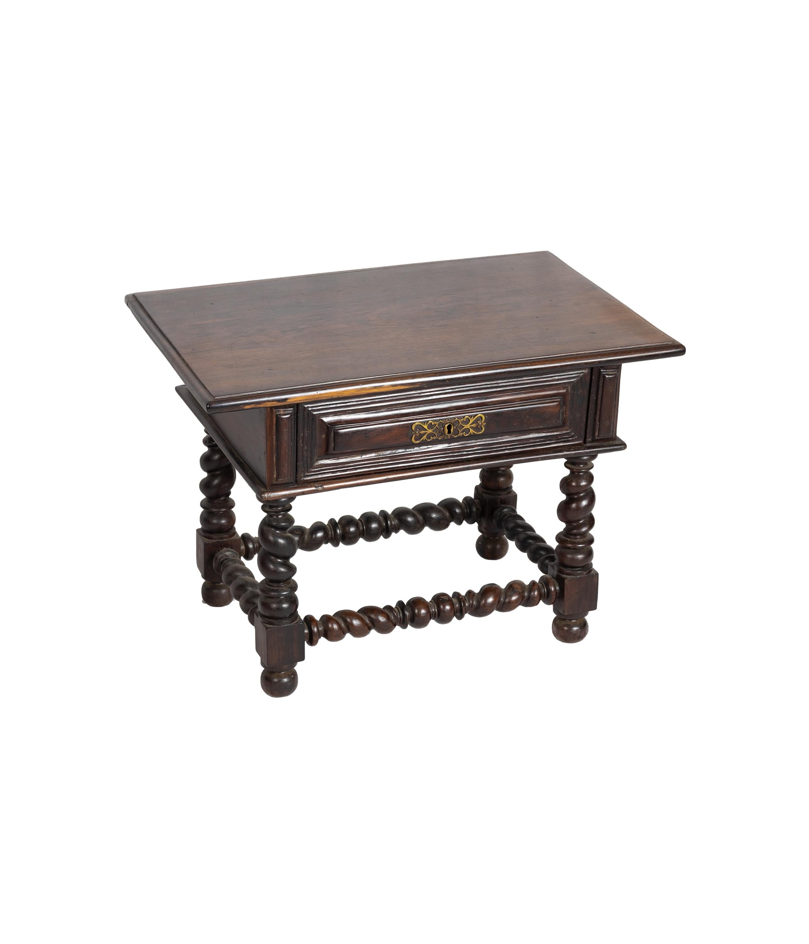 A short portuguese buffet table with shivered friezes, toned and riched carved legs, bulbous legs and ripple molds and brass hardware. 
An example of Portuguese aggregation of early Baroque boldness and the new Portuguese access to the rarest and