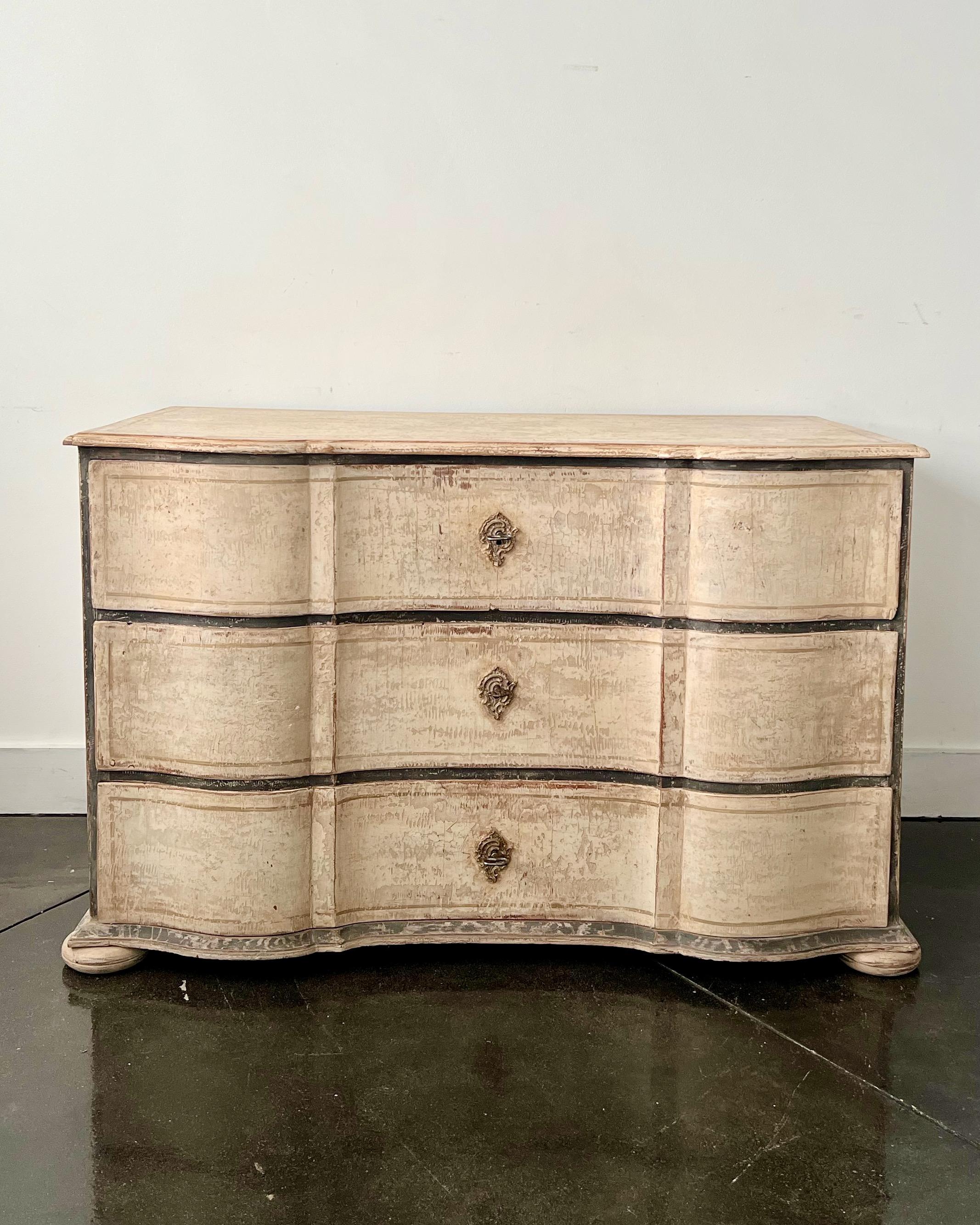 18th century Large chest of three drawers from late Baroque period in richly carved curvaceous serpentine drawer fronts, shaped top and on bun feet in super later patinated paint. Large very good condition sturdy antique piece.
Germany
More than