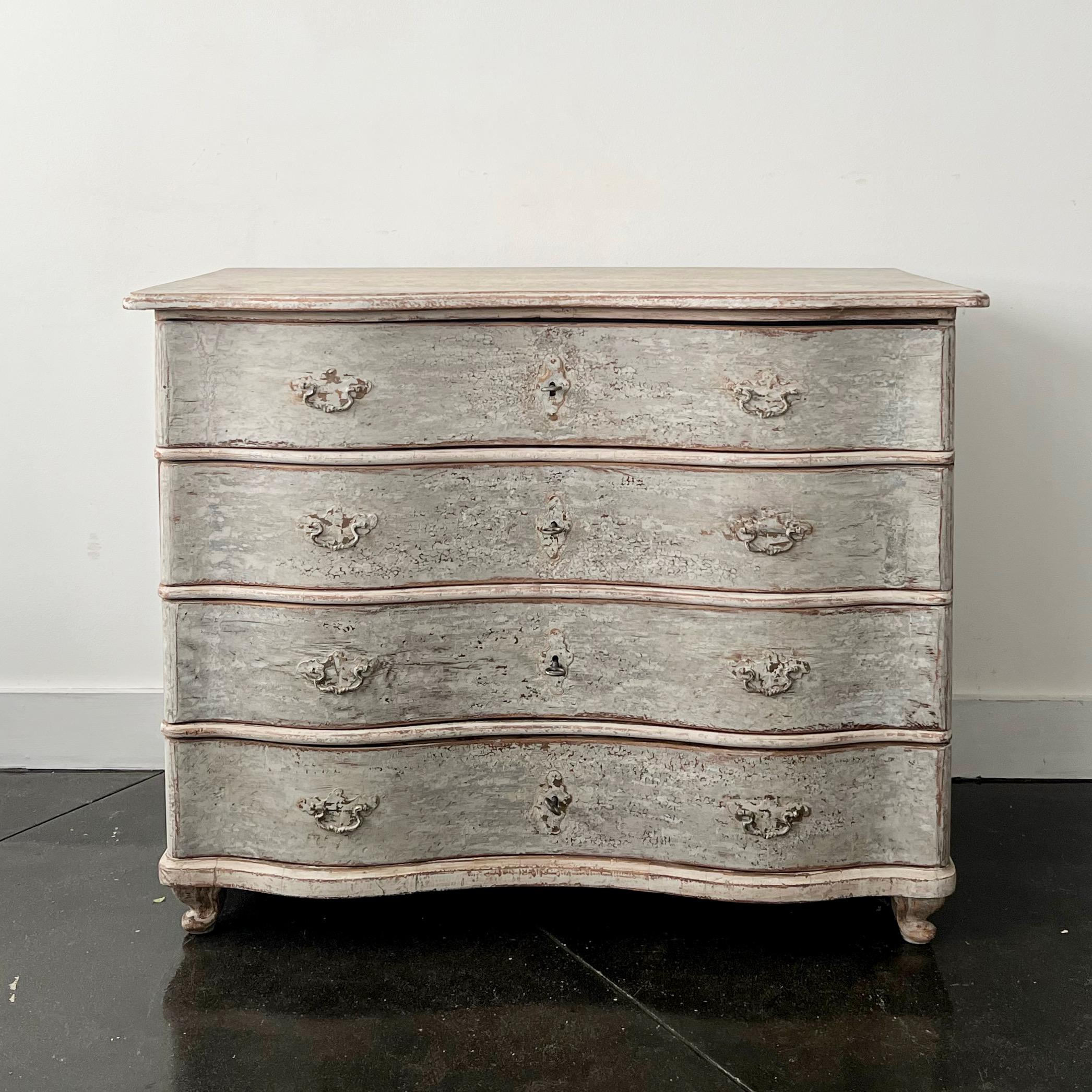 18th century Large chest of four drawers from late Baroque period in richly carved curvaceous serpentine drawer fronts, shaped top and carved feet in super later patinated paint.
Germany
More than ever, we selected the best, the rarest, the