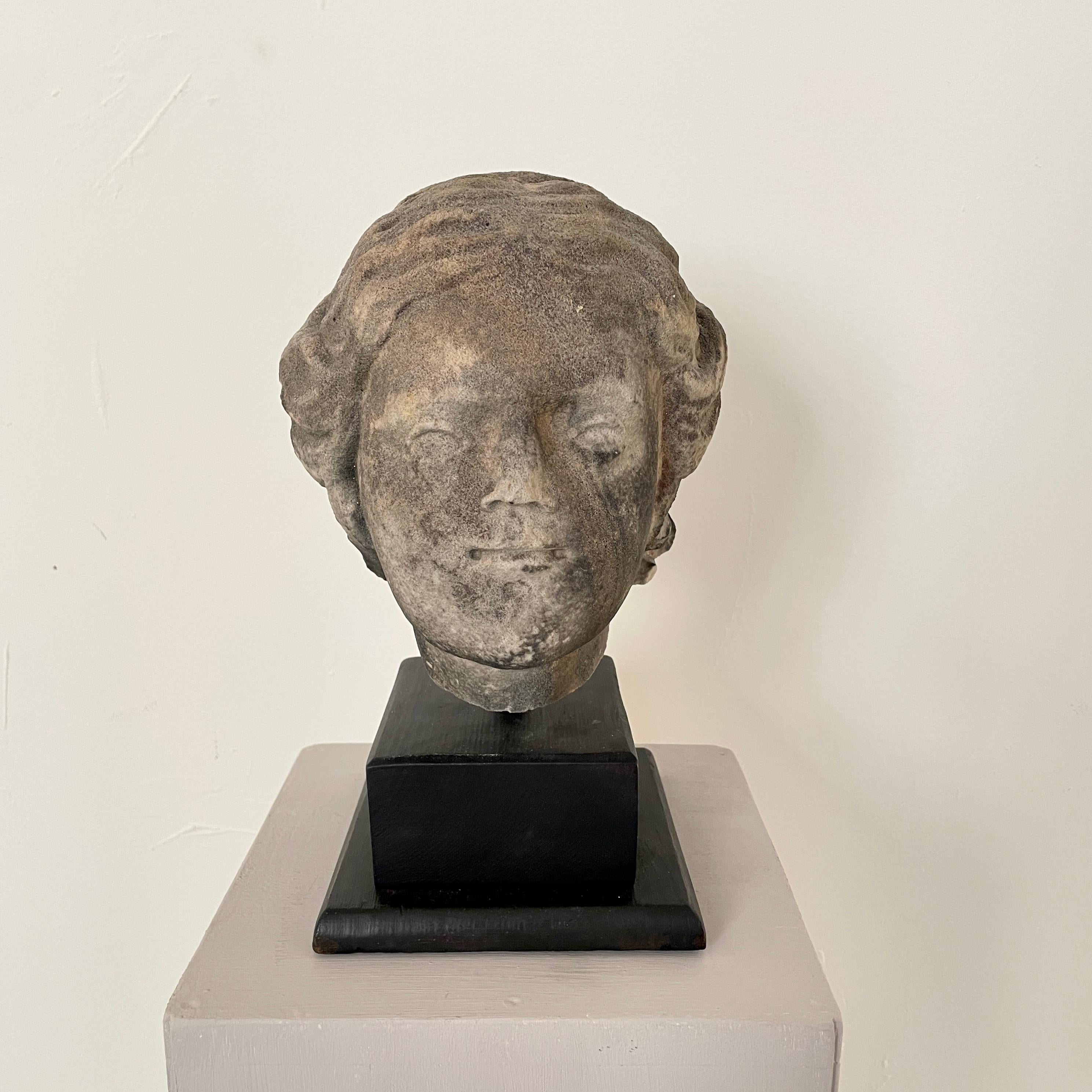 This fantastic 18th century Baroque hand carved sandstone head of a Woman was made around 1780.
It was probably part of a statue. Now it is sitting on a black wooden base.
It is in beautiful original condition and it remains a great Patina.
A