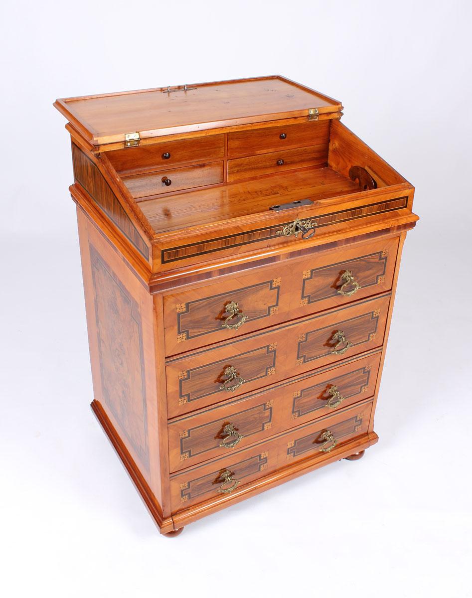 Baroque lectern, secretaire or chest of drawers

Southern Germany
Cherry tree, walnut tree and others
18th century

Dimensions: H x W x D: 102 x 72 x 55 cm

Description:
Very unusual and rare console-like secretaire, which can be also used