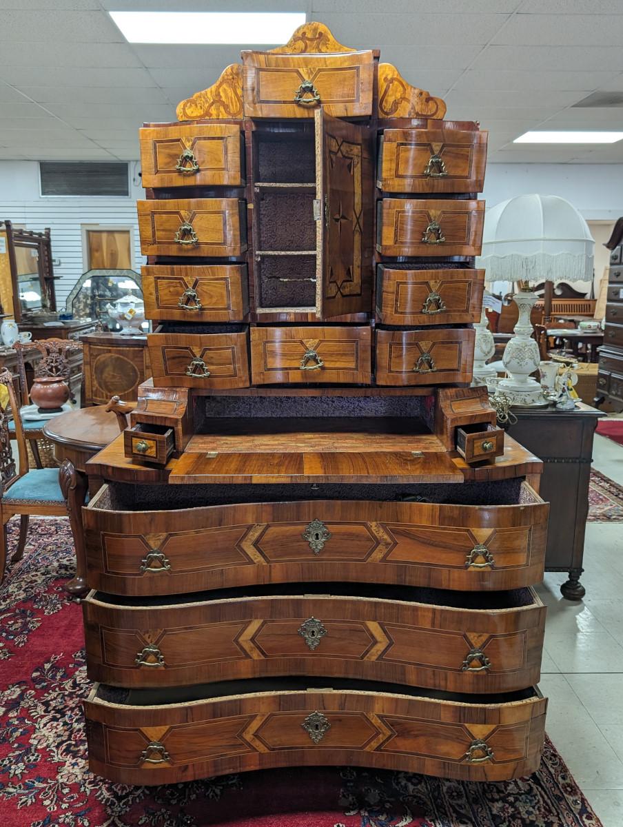 Gorgeous piece!!! Antique Secretaire, Mixed woods and inlaid marquetry, Has a shaped cornice, Top has several serpentine drawers and center door, bottom door opens to fold out writing surface, Bottom 3 large pull out drawers, entire piece rests on