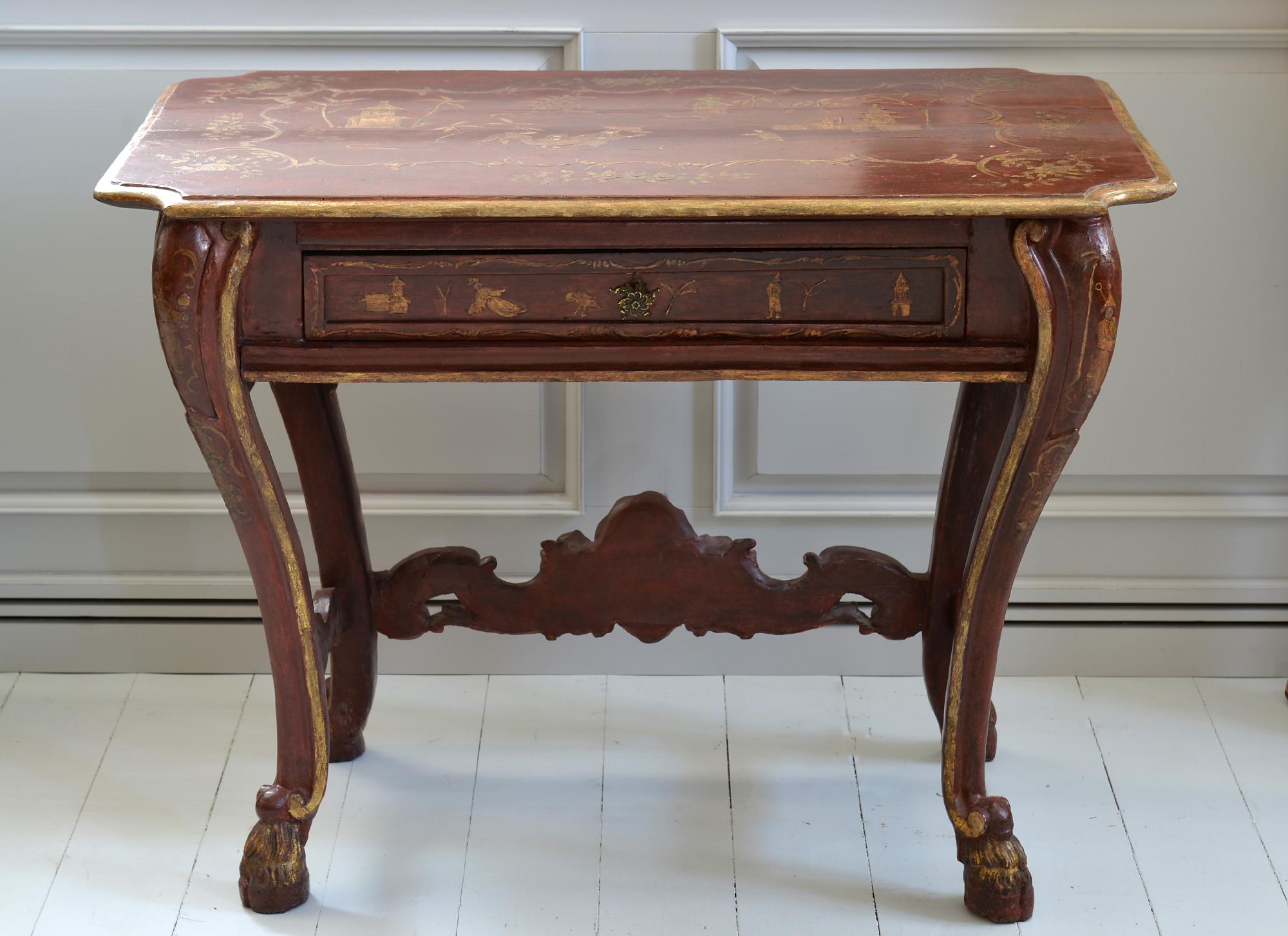 18th century Venetian center table
red lacquered with painted gilt figures
with one-drawer
a very unusual and rare Venetian table with lovely figures also on the top
in a very charming condition.
     