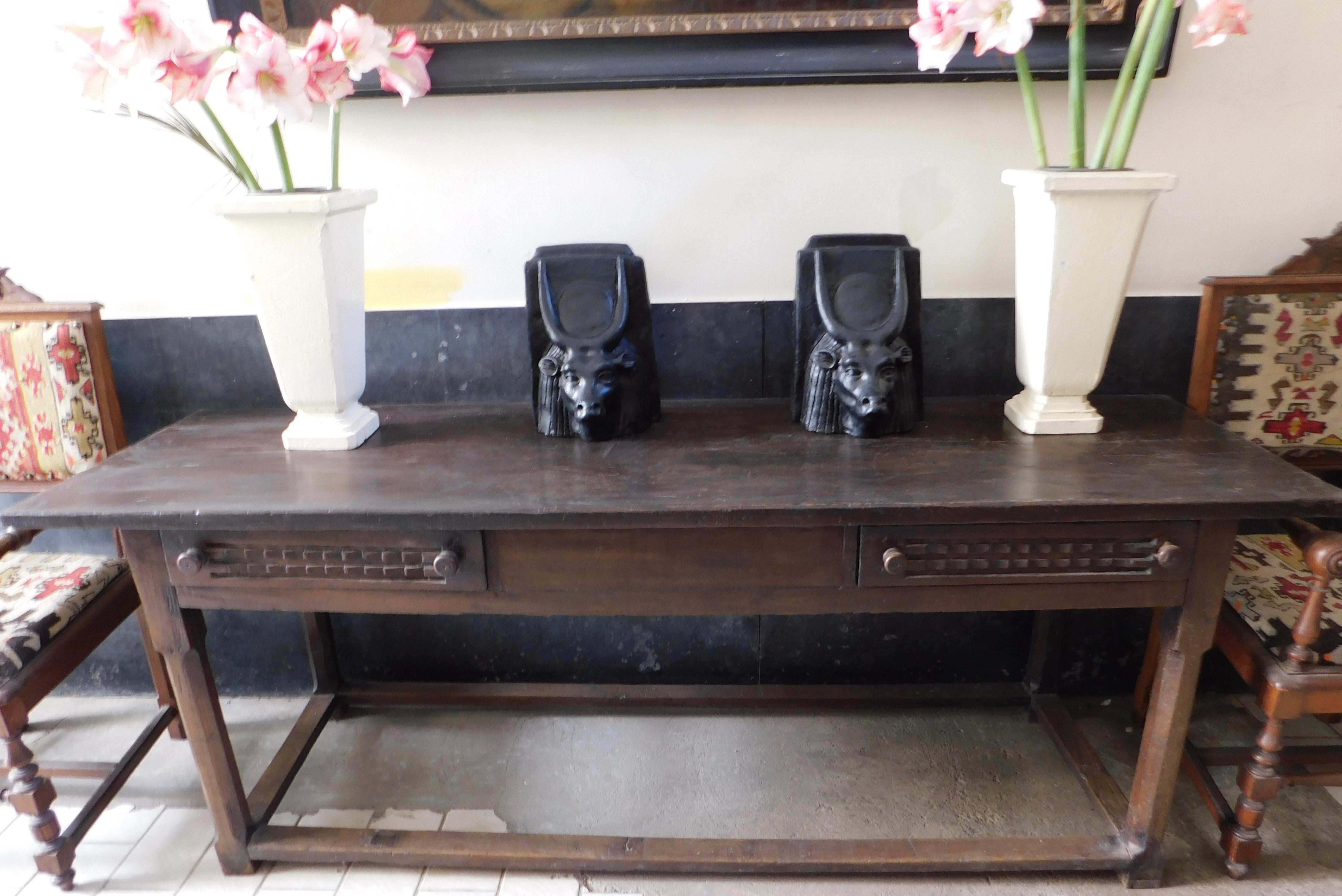 Rare French Basque region refectory table with two drawers and a wide one board top.
The drawers are carved with a most unusual raised step geometric fish scale design which (as the only carving) is set off by the elegant lines of the table. The