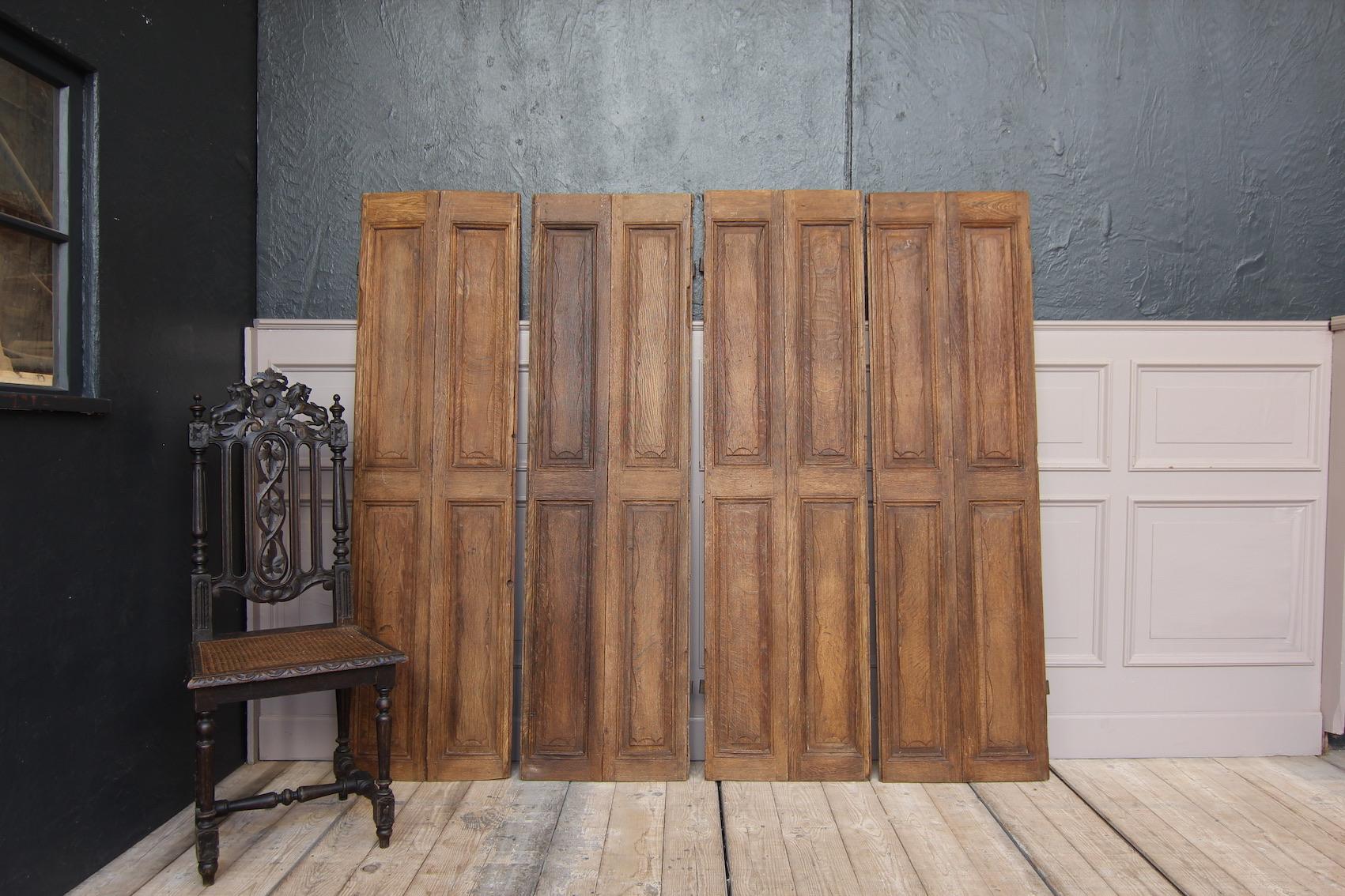 2 pairs of folding shutters. Belgian, 18th century.
Made of solid oak with panels and iron hinges.

Dimensions per piece (1 of 4 shutters): 
168 cm high / 66.14 inch high,
46.5 cm wide / 18.31 inch wide,
2 cm thick / 0.79 inch thick.
 