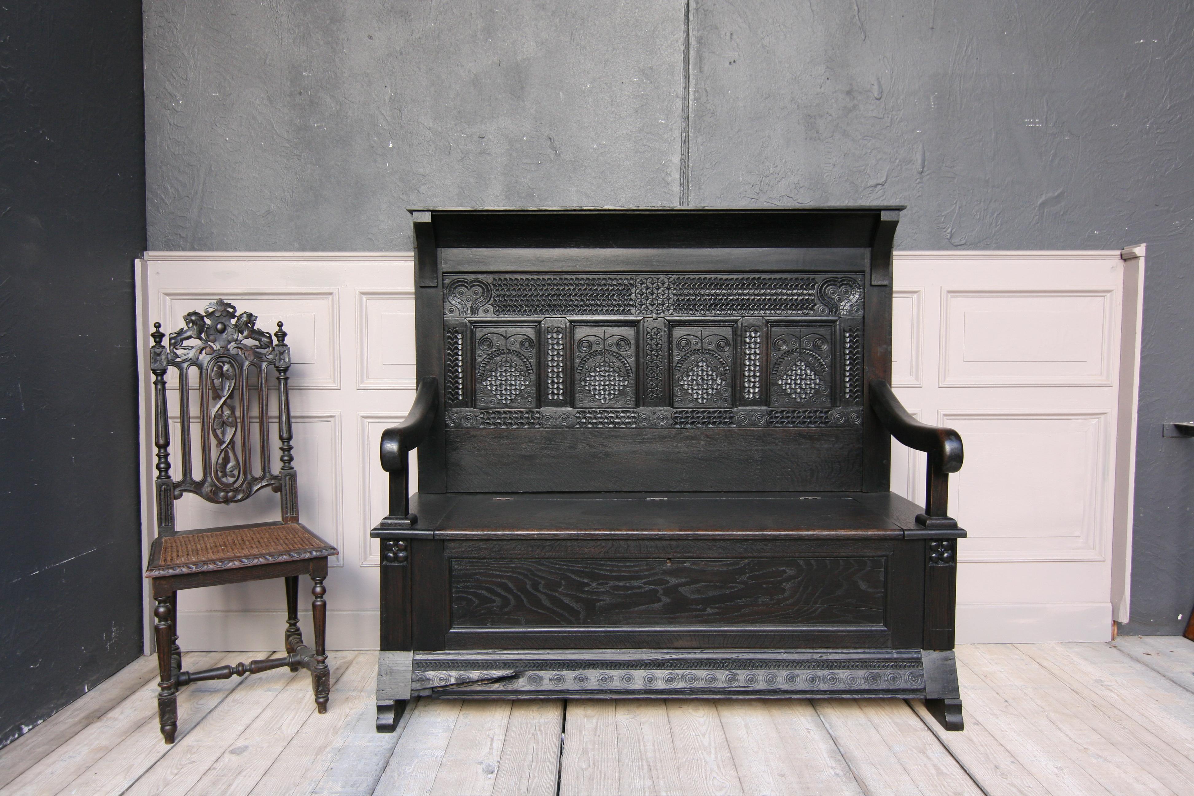 German bench from the 18th century, made of solid oak.

Dimensions: 
141 cm high / 55.51 inch high, 
155 cm wide / 61.02 inch wide, 
56 cm deep / 22.05 inch deep,
Seat height: 52 cm / 20.47 inch.