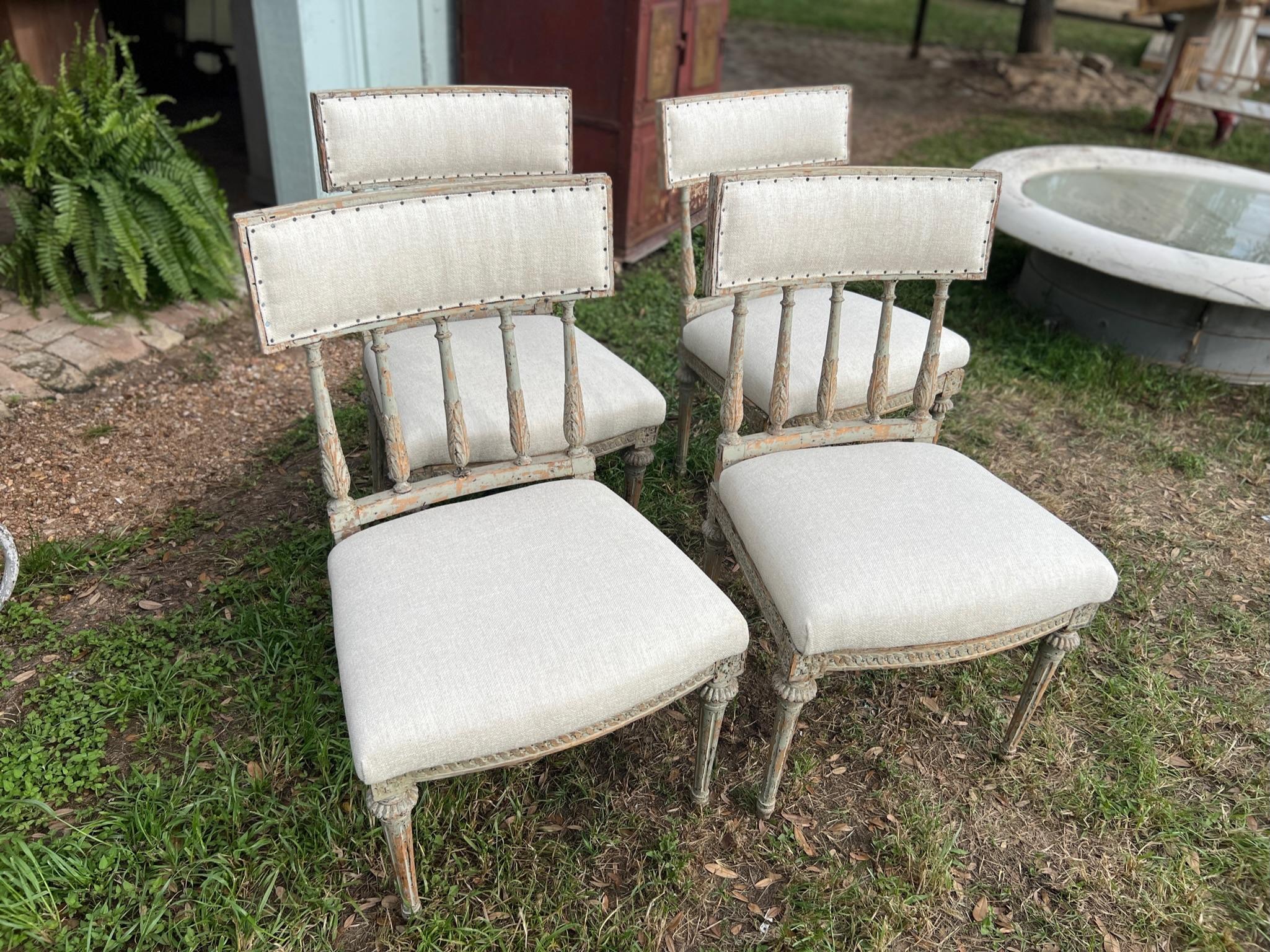 Absolutely stunning set of 4 large 18th century Gustavian dining chairs reupholstered in a beautiful Crypton fabric. These have been carefully dry scrapped uncovering the most fantastic shades of patina coming through with revealing a beautiful