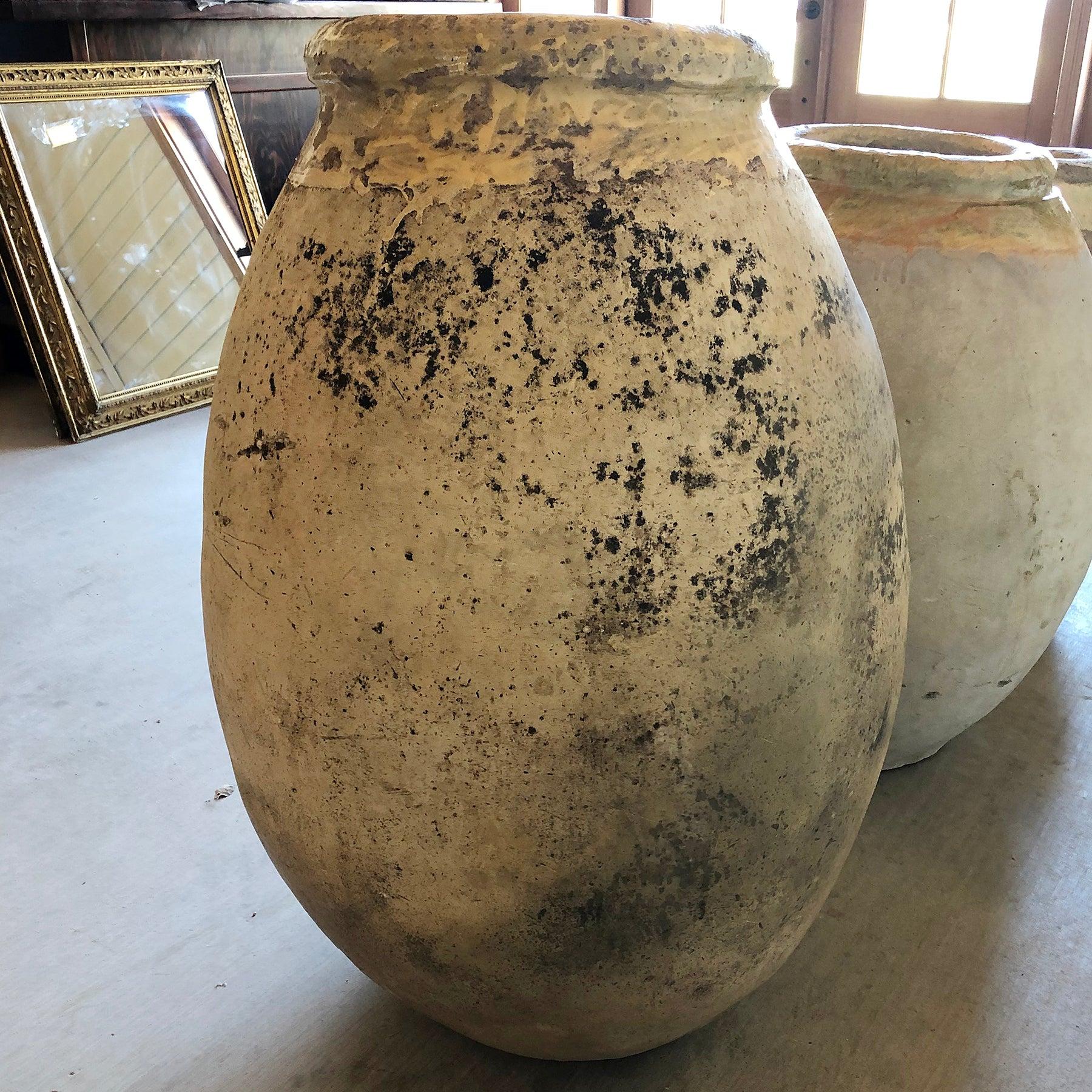 This Biot jar has a wide ochre glaze around the lip with a speckled body.

Classic French Antique Biot Olive oil Jars date back to the 16th century. 
Biot potters worked from generation to generation, and from 1550 to the late 19th century 510