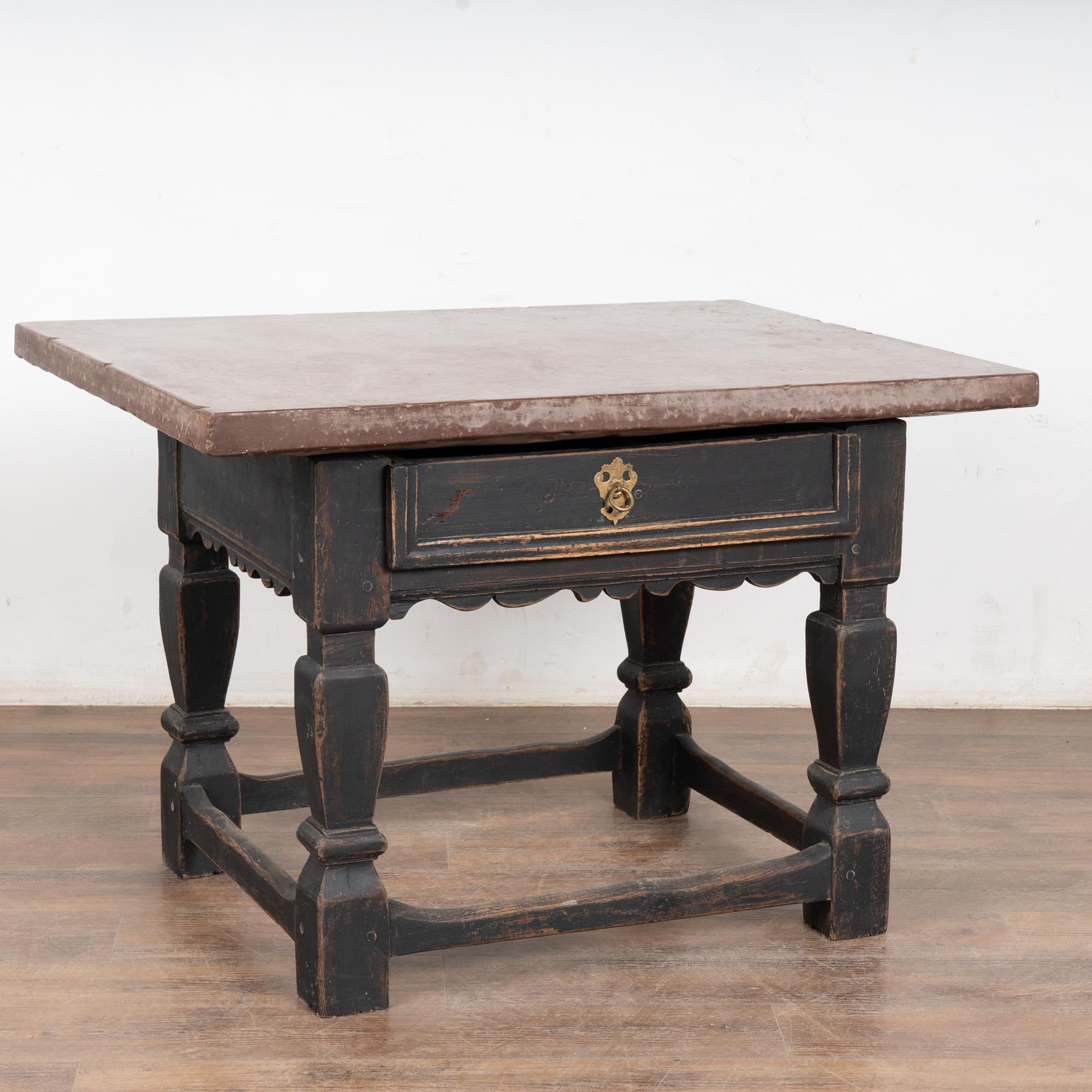 Baroque period stone top table from the 18th century, Sweden. This impressive table features a deep plum colored 2