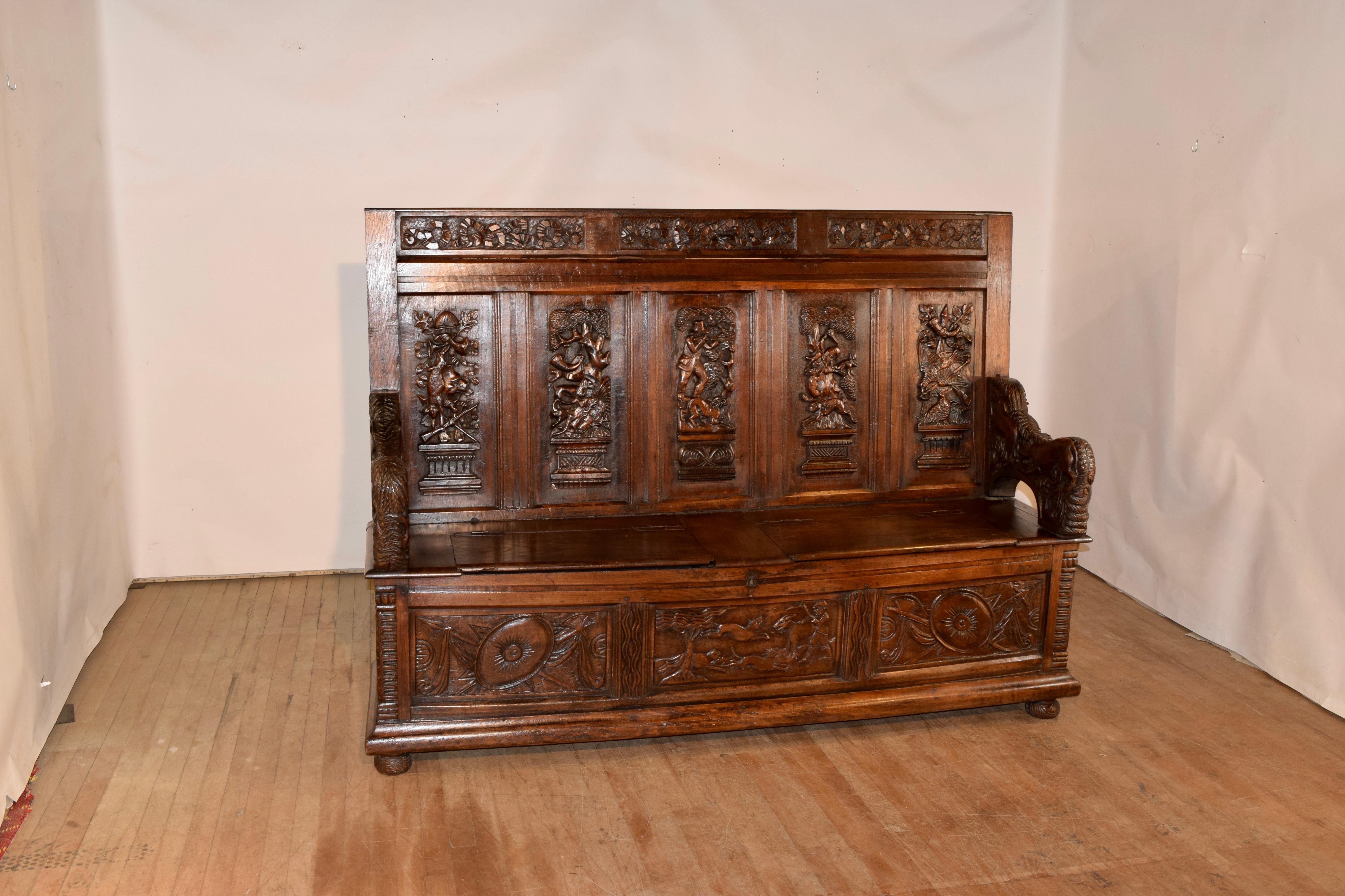 Spectacular 18th century hand carved bench from Germany. This bench is the best Black Forest bench we have had the pleasure to offer. The carving is exquisite. The back has three hand carved panels with ribbons over five hand carved main panels,