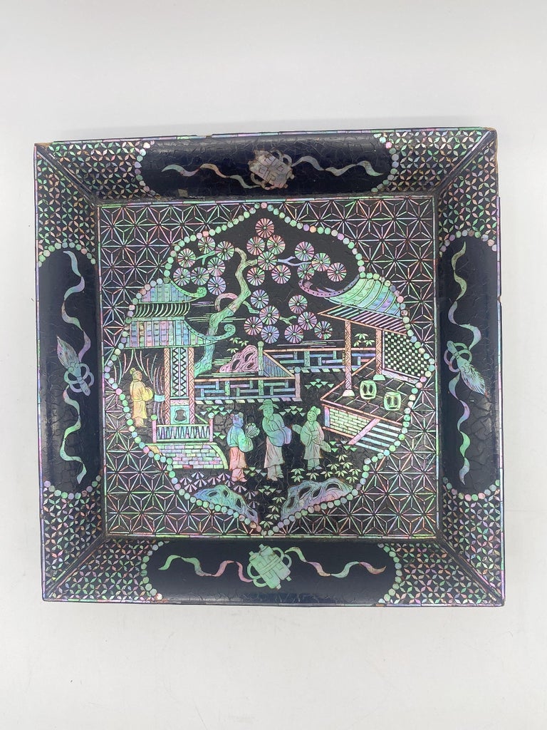 18th century black lacquer mother of pearl inlay plate, decoration as expected for age and use. Very beautiful and hard to find like this. Size: L 21cm x W 21cm.