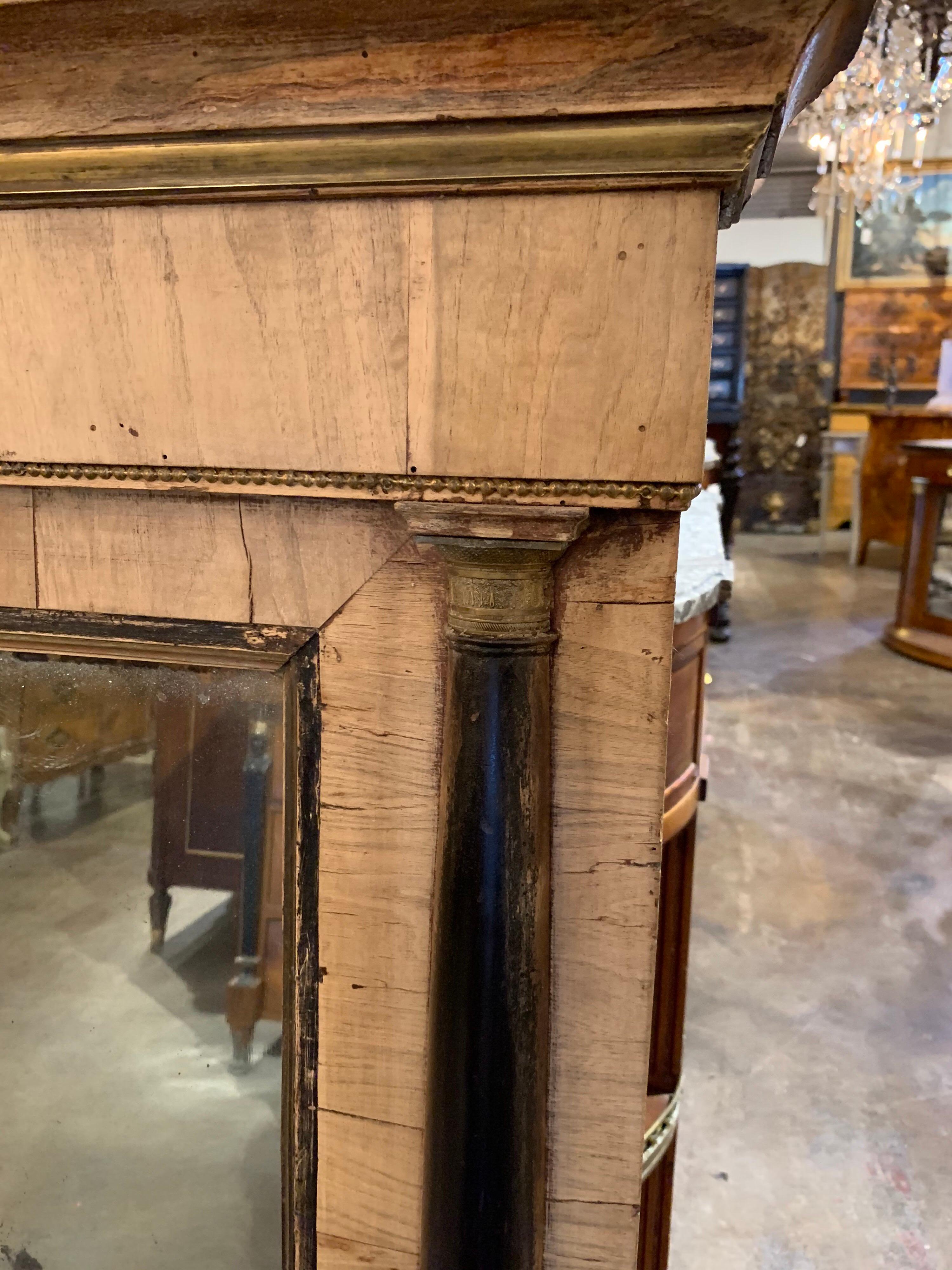 Beautiful antique 18th century Italian bleached walnut Empire style mirror. Nice ebony details on the sides of the mirror. A Classic, handsome piece!