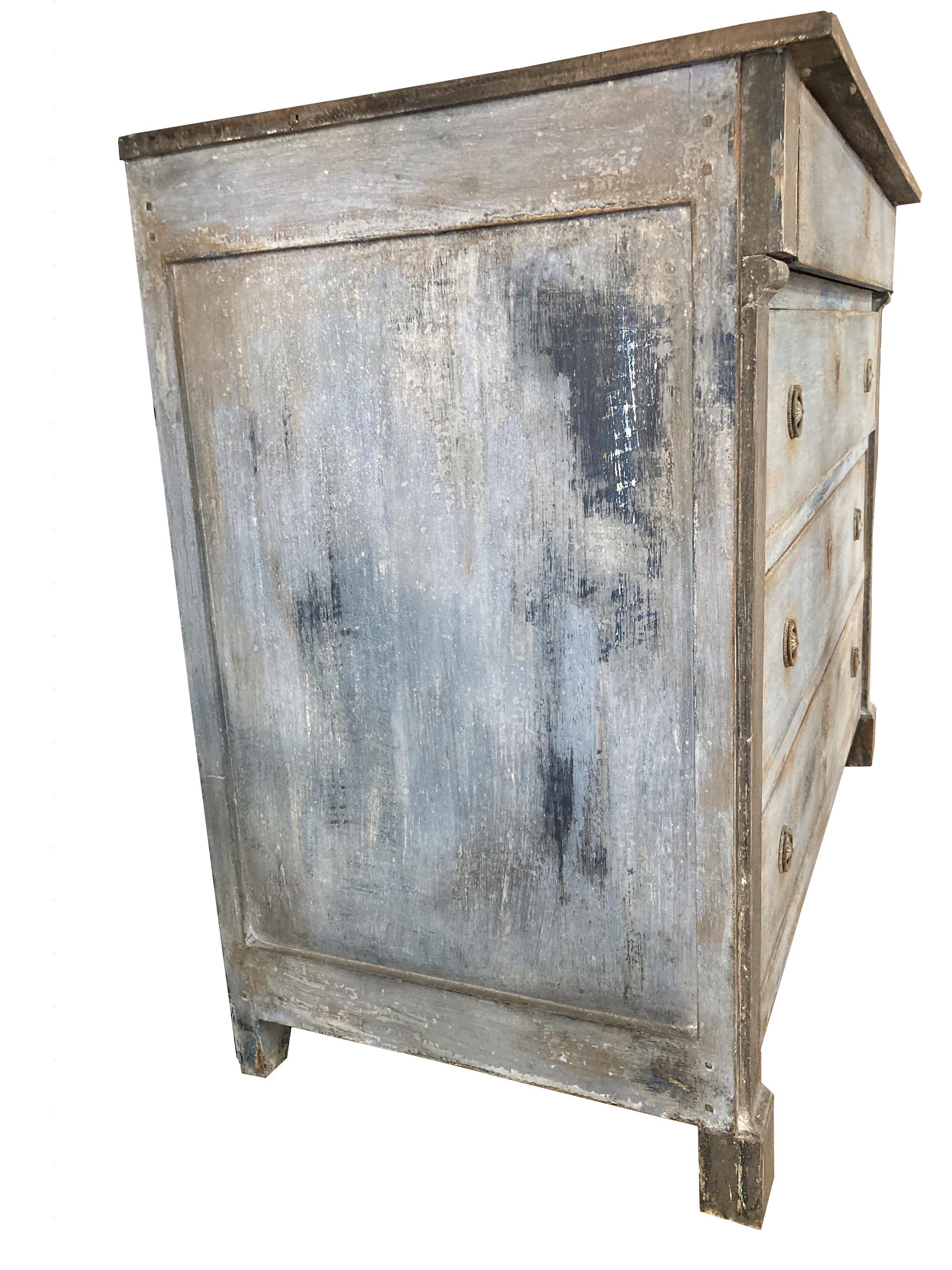 Large empire commode hand-built in France in the mid 1800s using oak. The chest is very large and tall, making it a perfect piece for whomever is looking for a statement commode that can be practical and decorative at the same time. The piece is