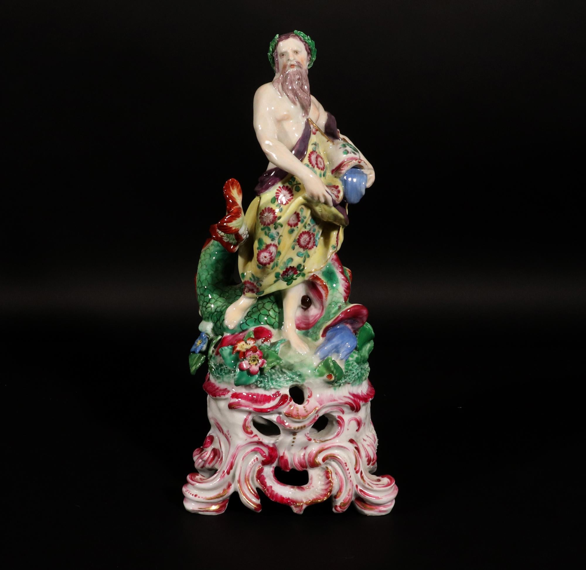 Bow Porcelain Rococo Figure of Neptune,
Circa 1760-65

The figure is a stunning example of English Rococo period porcelain.  Neptune stands on a grassy mound with pink flowers at his feet.  He wears a yellow robe decorated with flowers.  He holds a