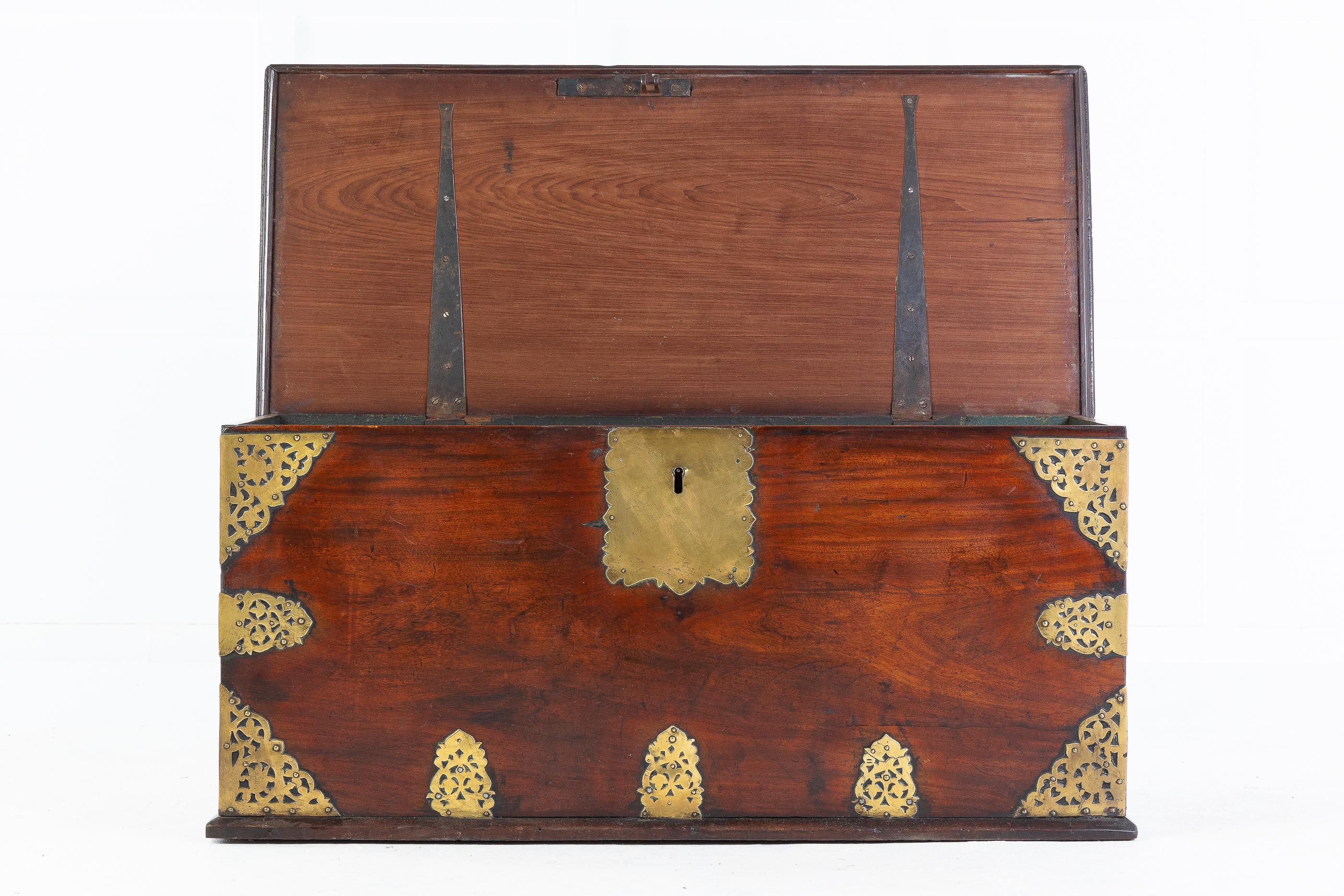 The top, sides and front decorated with pierced foliate mounts, super color and patina. The large single plank top has wonderful grain and a moulded edge. There are beautiful pierced brass mounts to the corners and lock plate.

The chest is