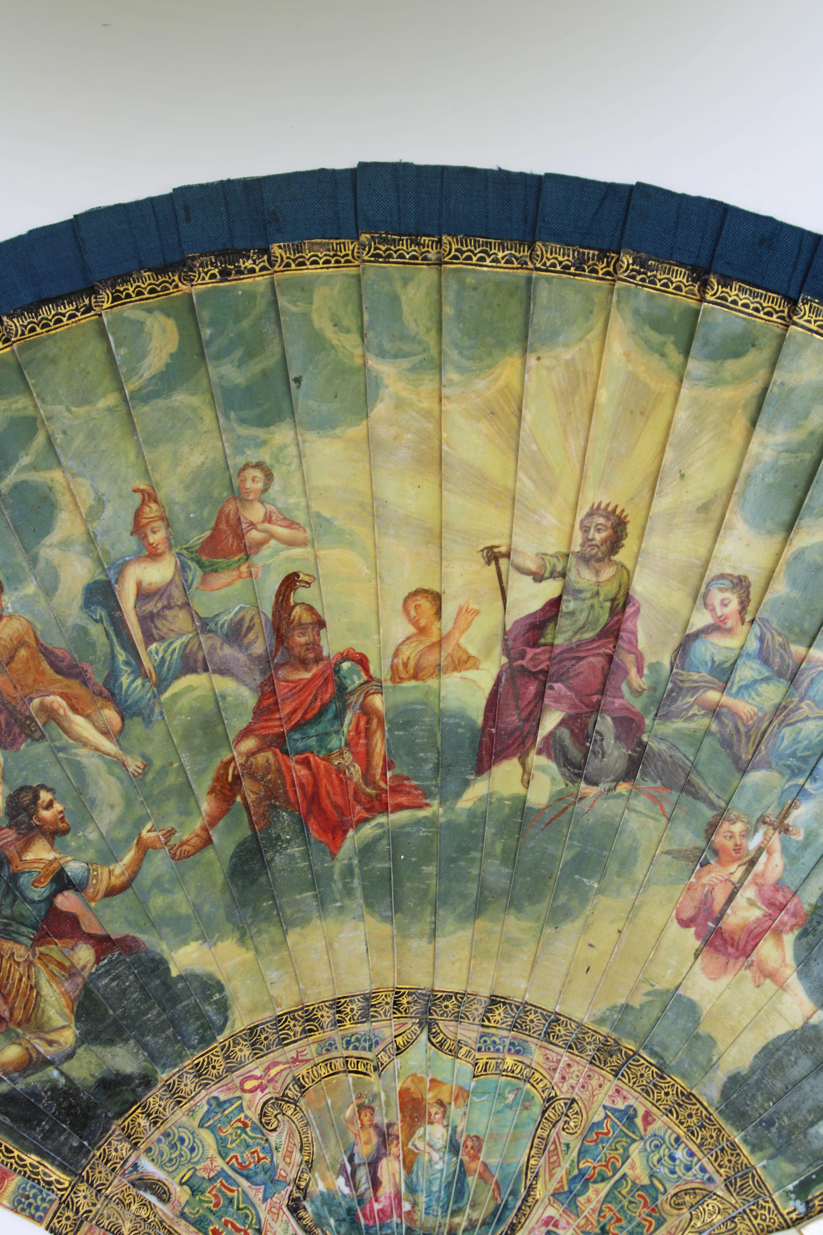 Introducing a remarkable mid-18th century Brisé fan in Vernis Martin, a true testament to the exquisite craftsmanship of its time. This hand-painted fan features a double-faced design, each side telling a unique story.

The front side vividly