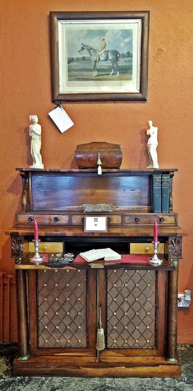 Fantastic piece in impeccable condition. Regency exotic hardwood bureau or secretaire desk or cabinet of lovely proportions.
From circa 1790. The top portion consists of an open columned pelmet and shelf with a series of drawers underneath. All made