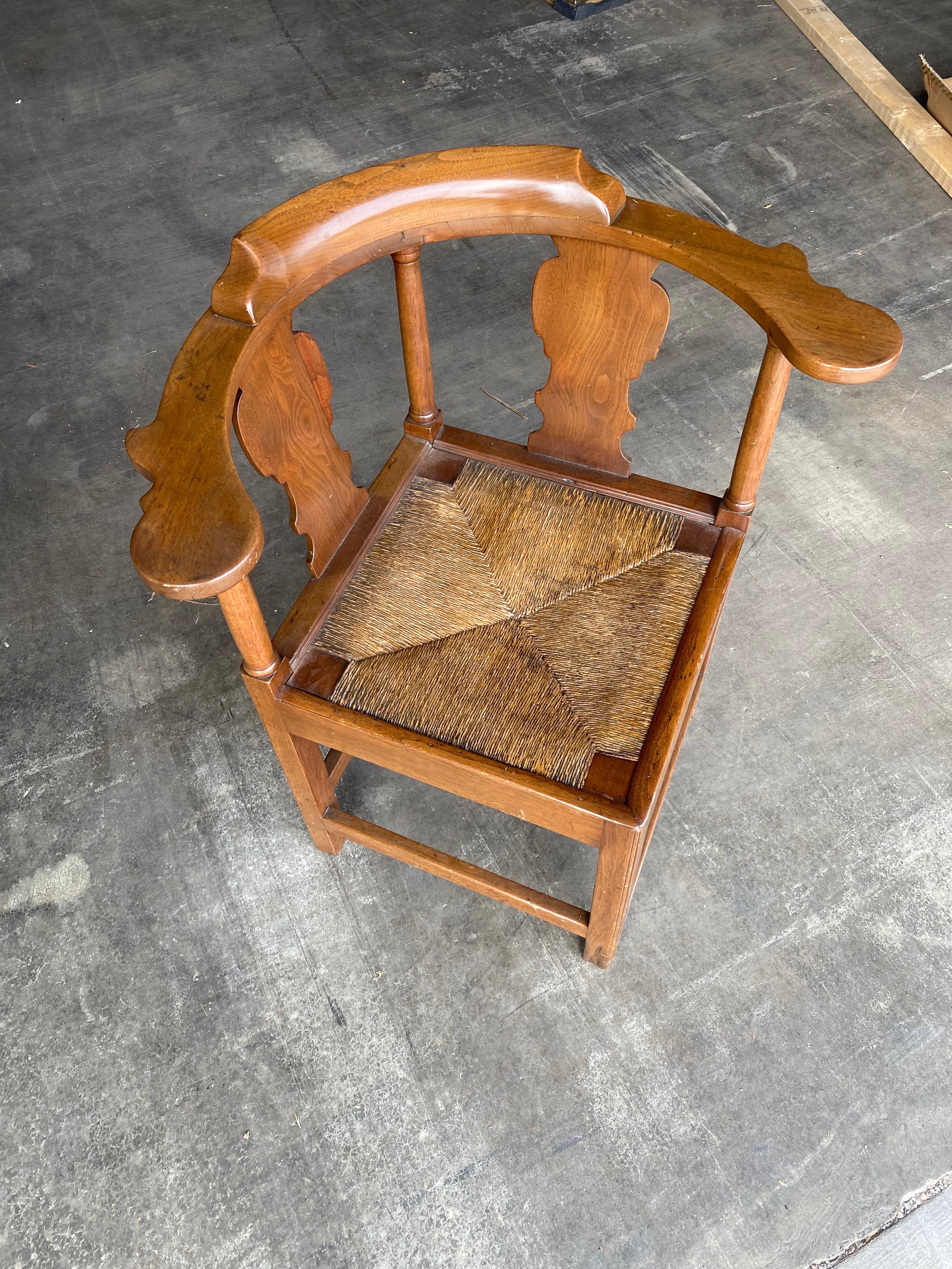 18th century British walnut corner chair with rush seat.
