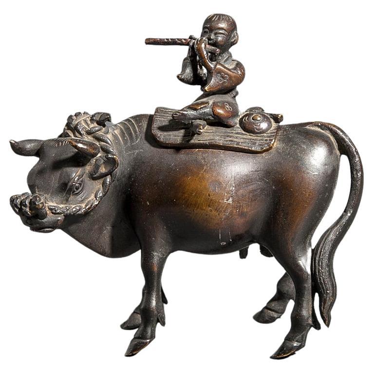 Encensoir en bronze du XVIIIe siècle représentant un garçon montant un taureau