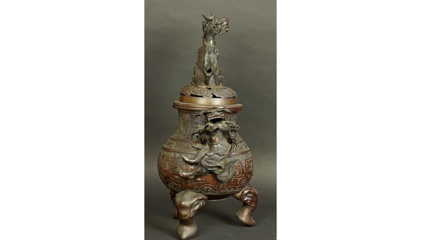 18th century bronze China censer
A large dish with an openwork lid standing on three elephant heads with two Chinese lions on the sides and a dragon on the top of the lid. Genre scenes on the body.
China, 18th-19th century
Patinated bronze.
 
 