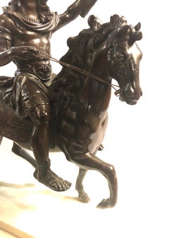 An 18th Century Bronze Equestrian Group of Louis XIV on Horseback