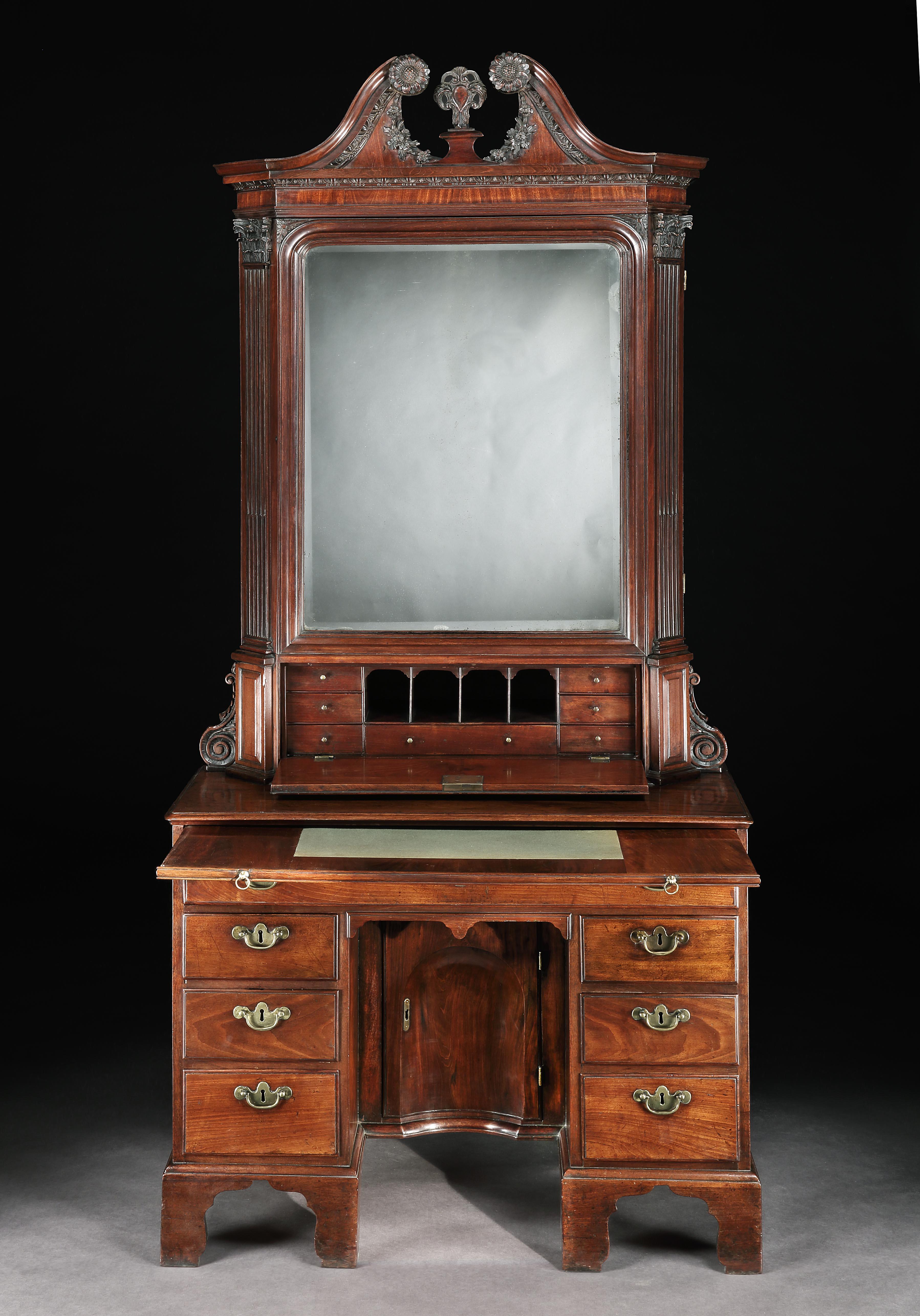 A rare 18th century Irish mahogany knee-hole cabinet. The superbly carved swan neck cornice with Irish sunflowers carved garlands of flowers and an egg and dart mouldings, above a single original glass door flanked by Corinthian columns, with a