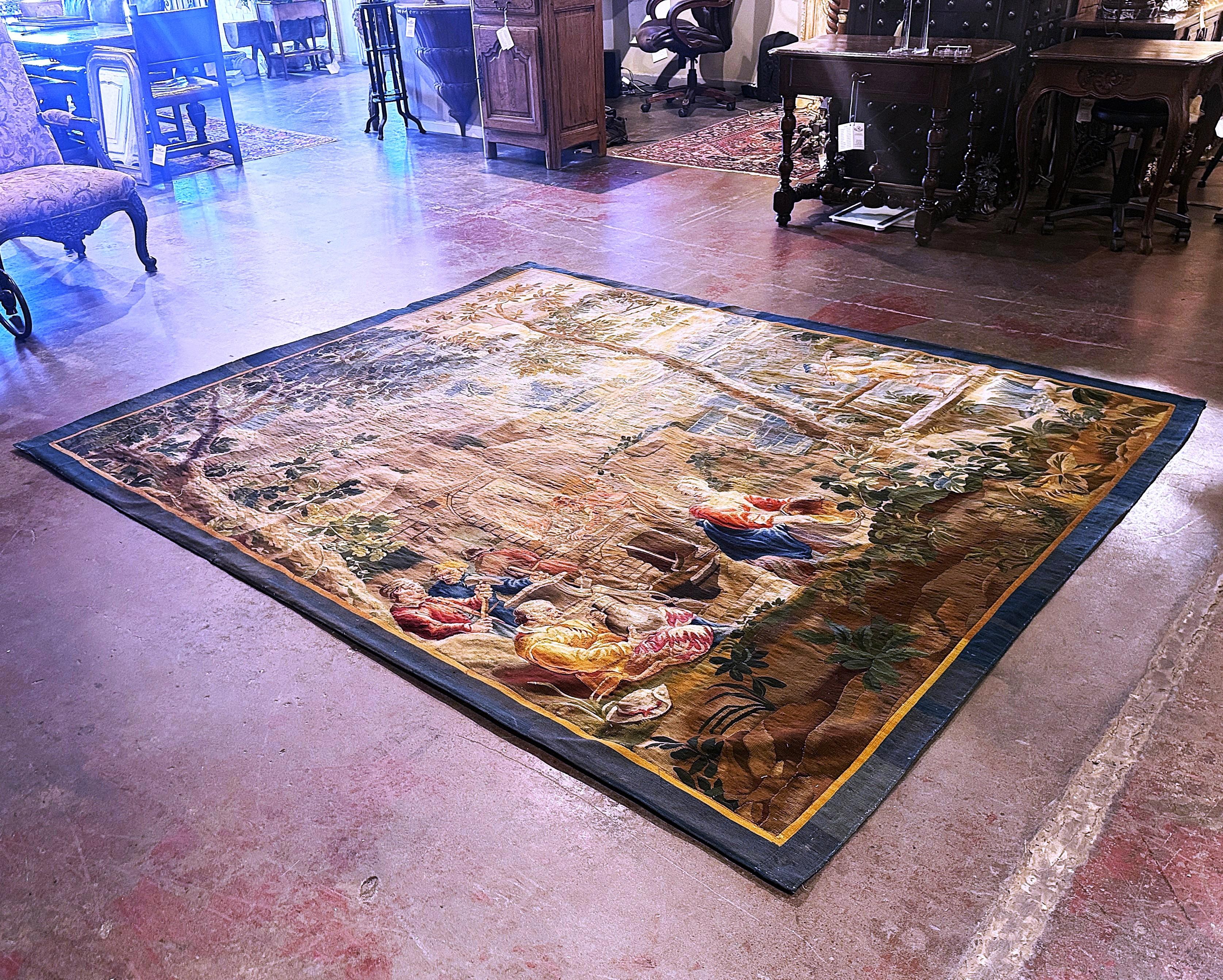  Crafted in Brussels, Belgium circa 1750, this exceptional pastoral tapestry is a perfect accent for a living room or staircase. The composition is rich with detail, featuring a group of people dressed in period attire and engaging in daily