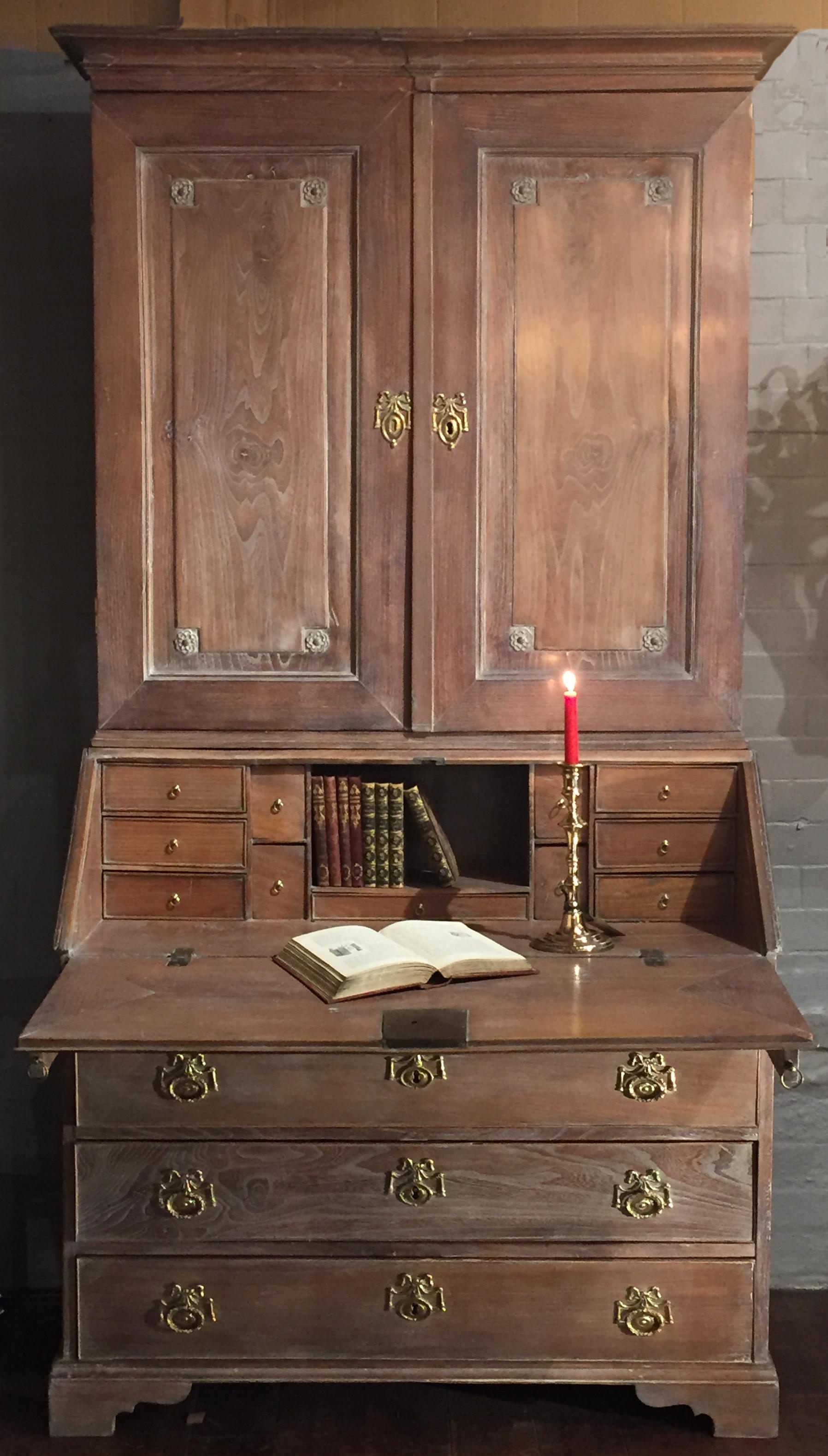 A wonderful 18th century Swedish bureau bookcase of limed elm retaining its original hardware with working locks and keys.
The upper section with double paneled doors, with mitred tenon joints, which open to reveal shelves, pilasters, a lower