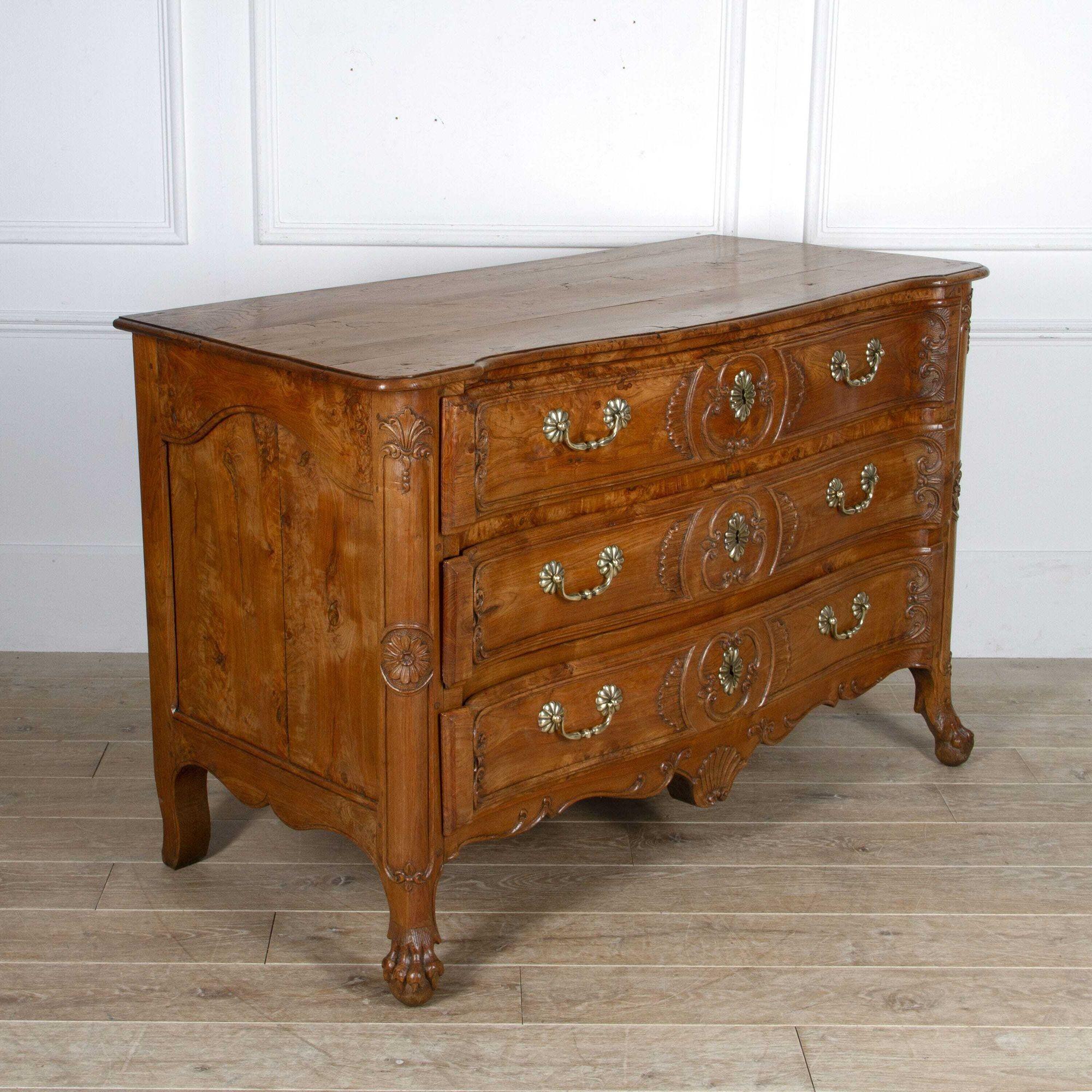 Wonderful 18th century burr ash commode. 
This commode is in a typical country house style. 
This fine piece offers great storage opportunities because of its large proportions. It has three drawers which are decorated with their original brass