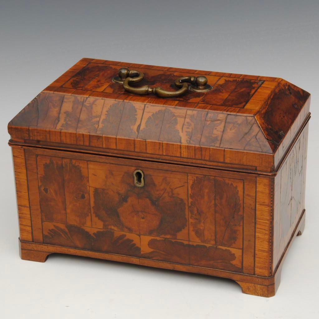 A fine example of a burr thorn and crossbanded tea caddy of superb color and patina with the original brass handle and bracket feet,
circa 1750.