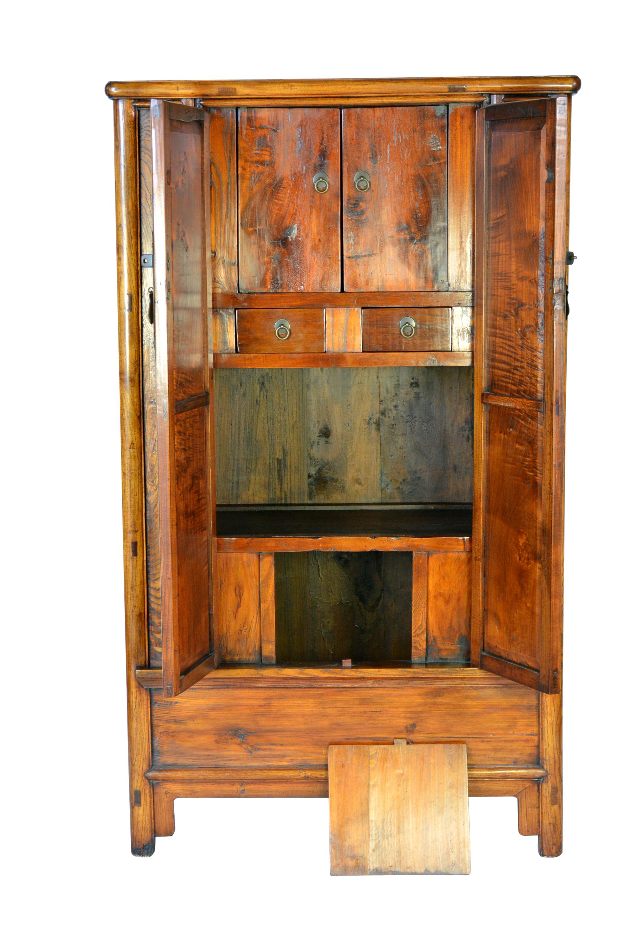Round cornered cabinet 66.75H x 39W x 21.5D
Round cornered wood hinged cabinet with removable center stile, two interior drawers and two compartments with a protruding stretcher and panel below the door. There is a simple tongue and grooved apron