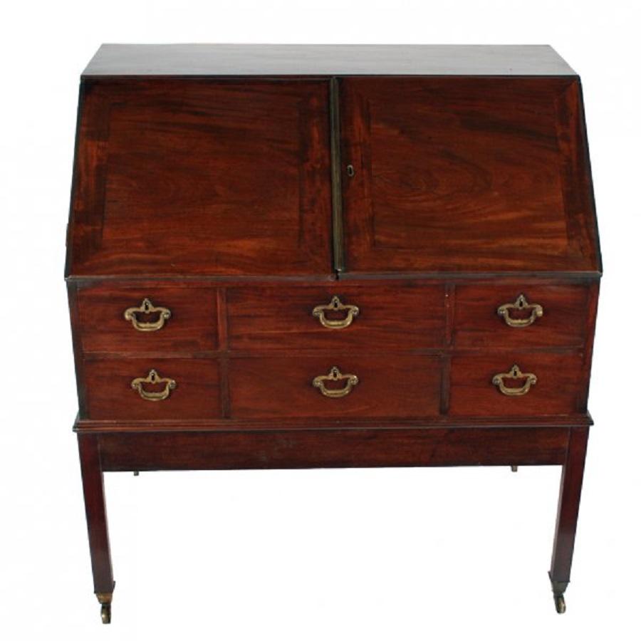 An unusual 18th century Georgian mahogany campaign bureau.

The bureau sits on a mahogany folding stand, has six drawers with oak linings and solid mahogany drawers fronts that have their original brass handles with open back plates.

The bureau