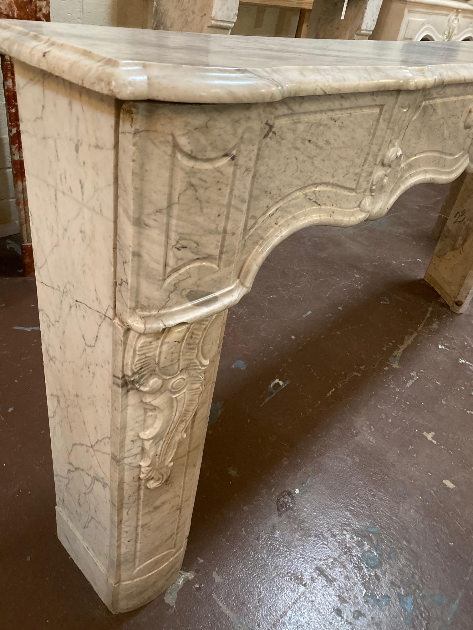 This Louis XVI transitional period Carrara marble mantel features undulating carved frieze.

Measurements: 83.5” W x 11.5” D x 43.5” H
Firebox 67.5” W x 34.5” H.
