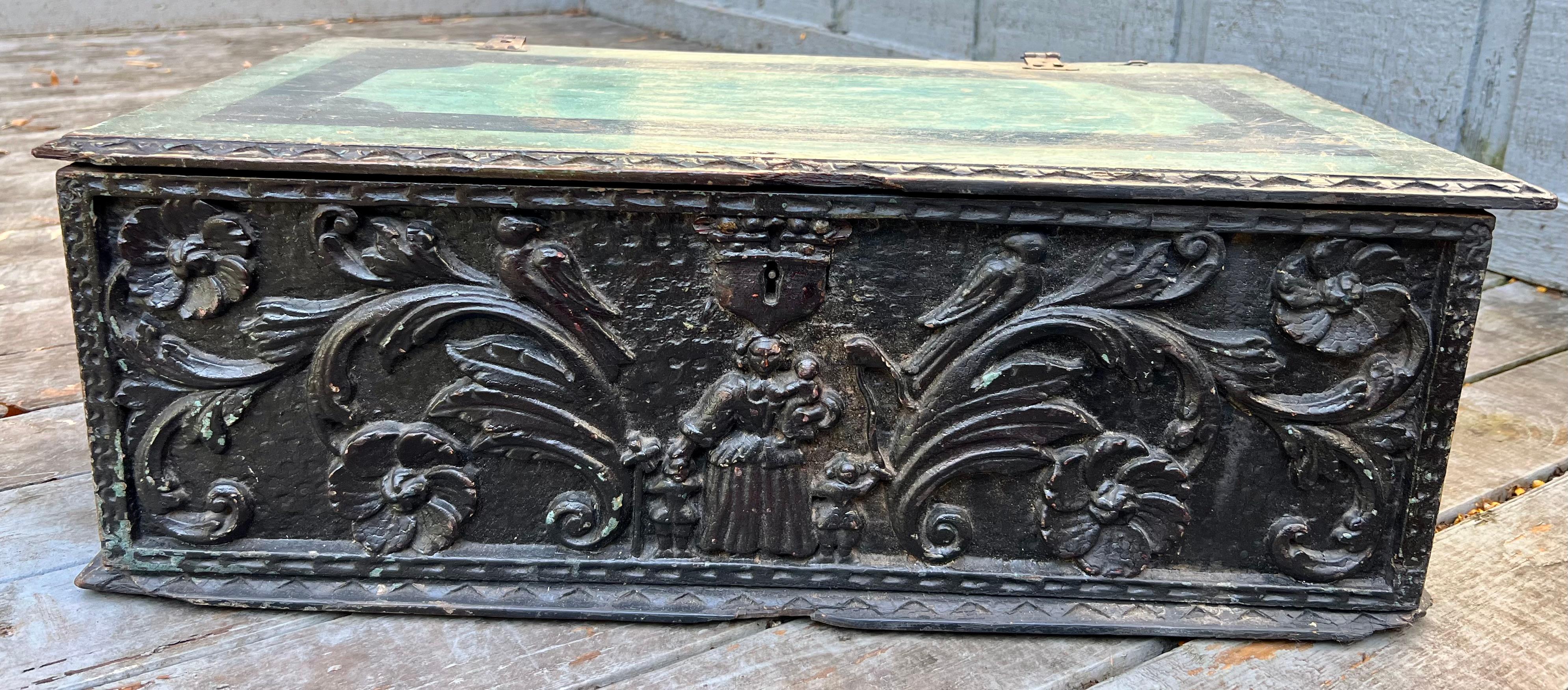 18th Century document or bible box. Heavily carved. With Rose head nails and old blue paint covered in heavy dark varnish in parts. Period painting of a hunt scene landscape on the interior of the lid.