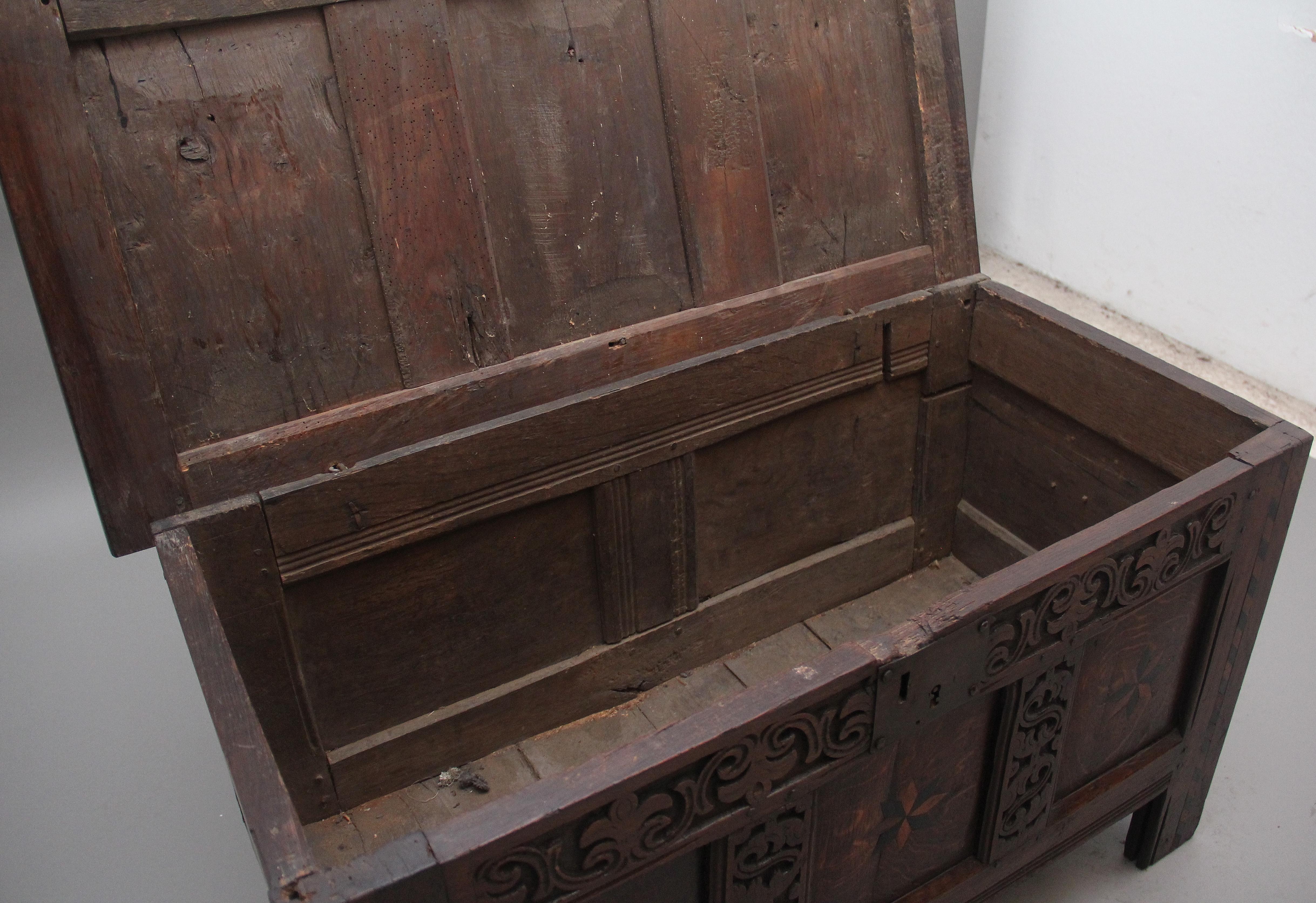 Early 18th Century 18th Century carved and inlaid oak coffer For Sale
