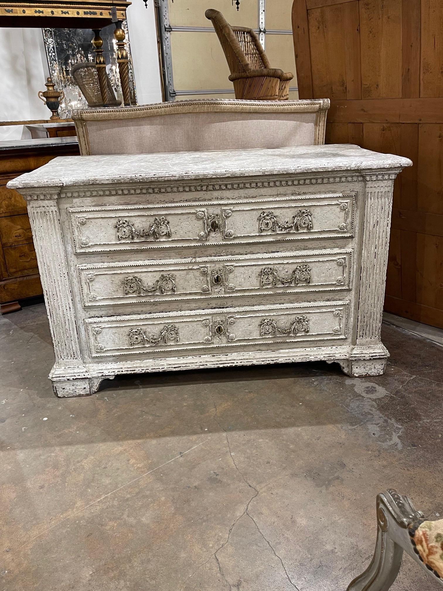 Fabulous 18th century French carved and painted oak commode. Amazing patina on this substantial piece and pretty decorative hardware. Beautiful!!