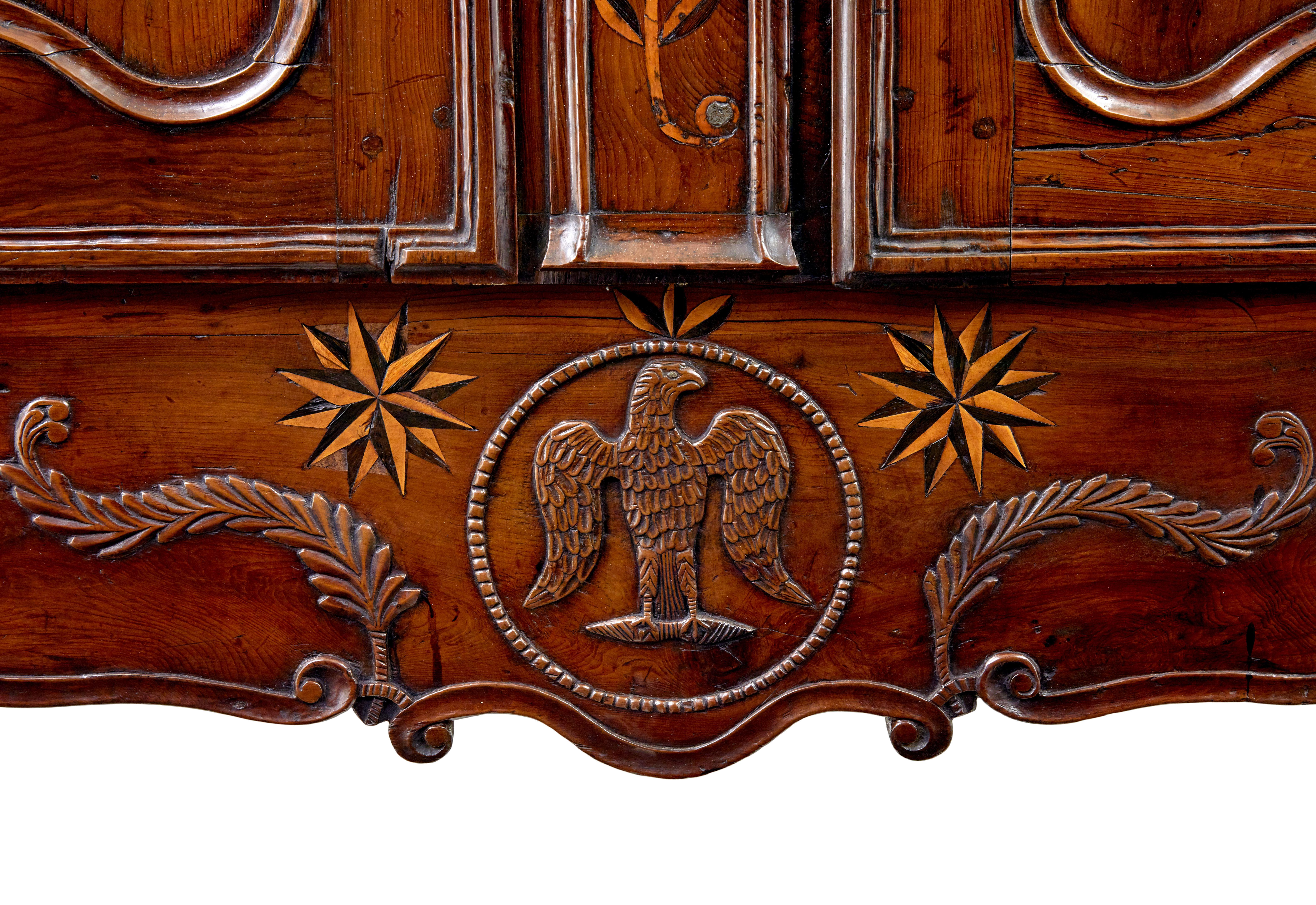 Chestnut 18th century carved French yew and chestnut armoire For Sale
