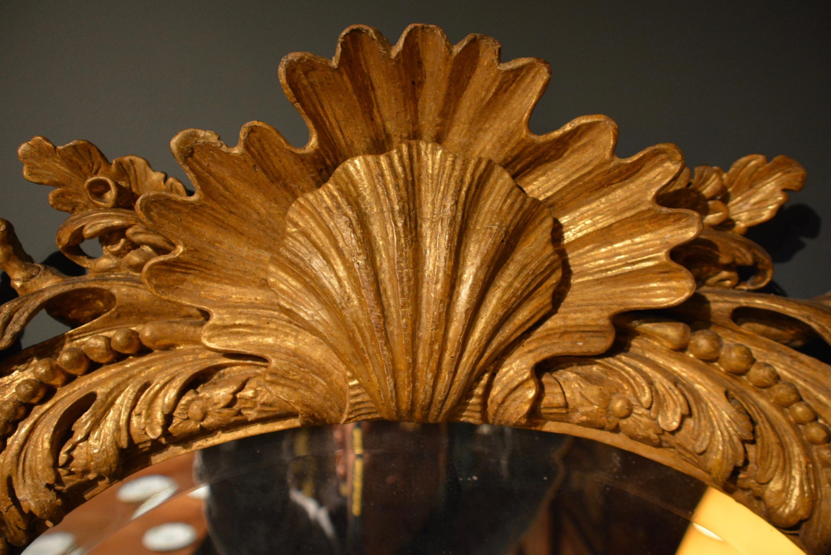 Georgian 18th Century Carved Giltwood Mirror of Unusual Form with Shell Cresting For Sale