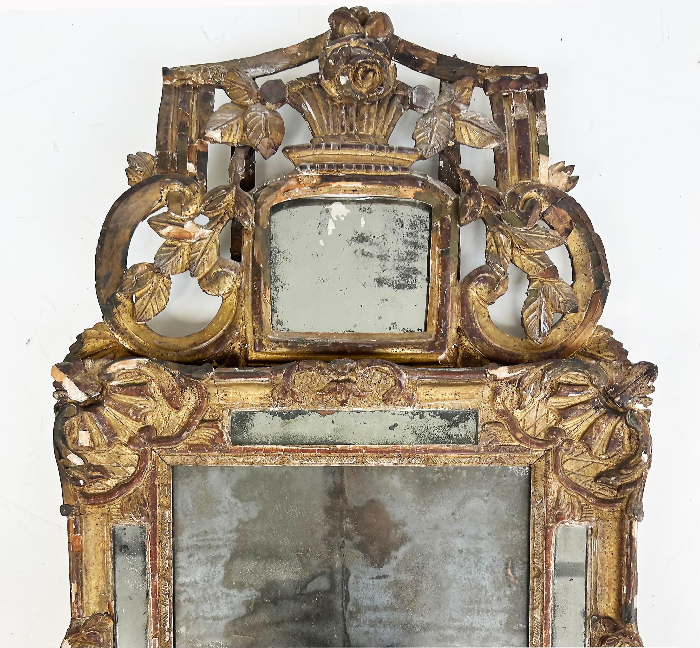 18th Century Carved Giltwood Gesso Provençal Mercury Mirror, Original Gilding

Offered for sale is an 18th-century French provincial carved giltwood and gesso mercury mirror with original gilding.  This early wall mirror is backed with wood and is