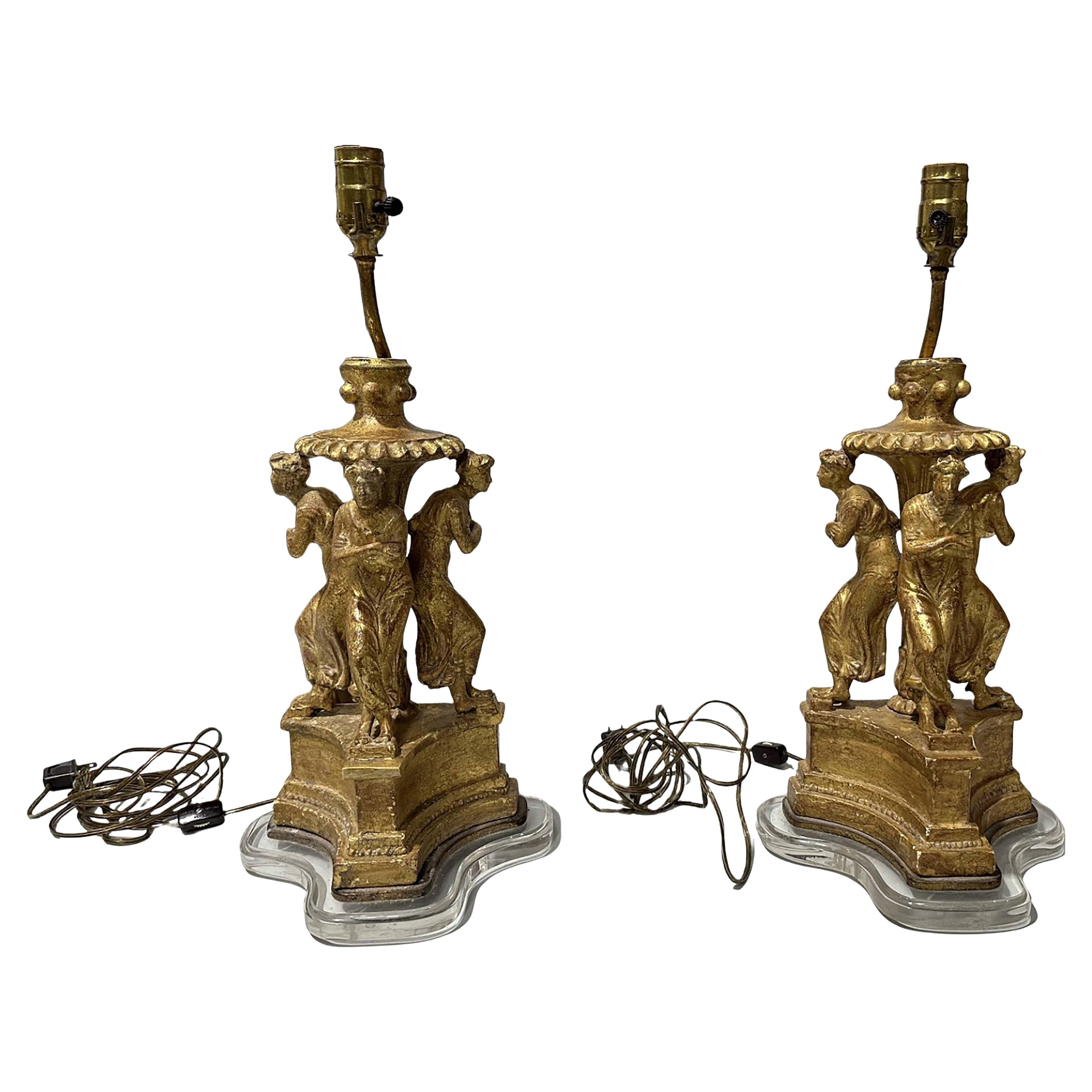 Lampes du XVIIIe siècle en bois doré sculpté sur base acrylique représentant la danse des Muses en vente