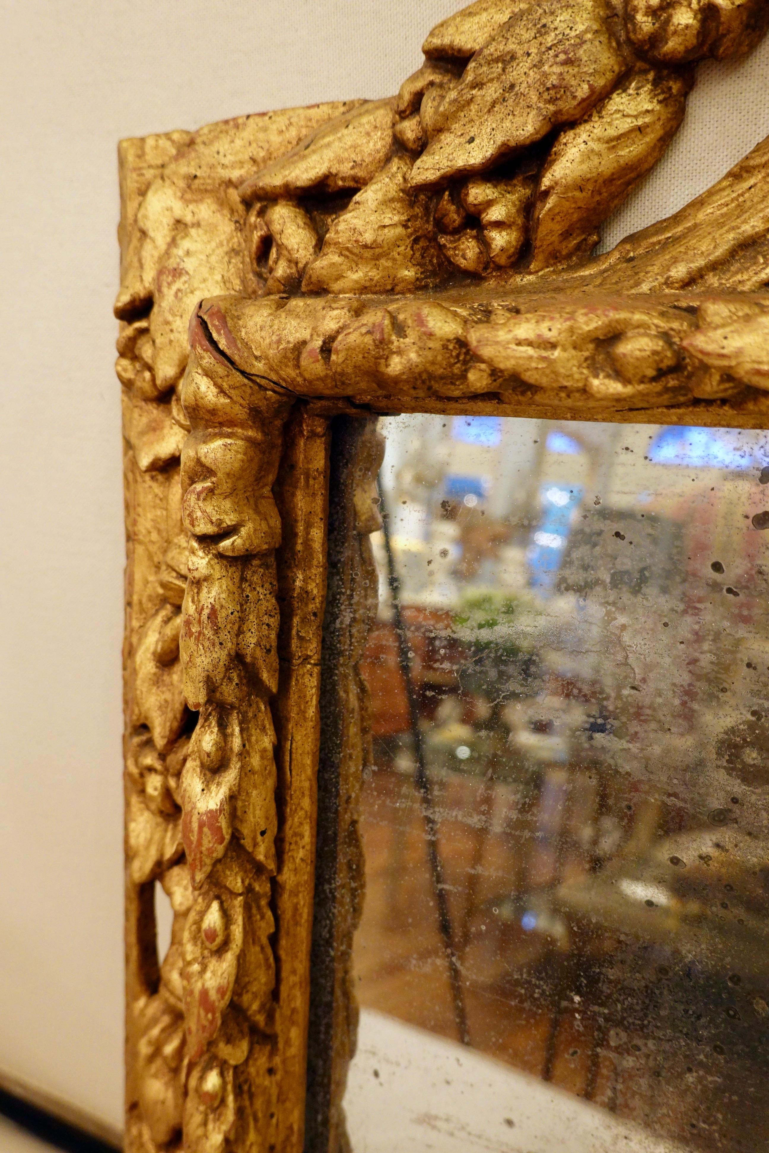 18th Century Carved Giltwood Mirror with Eagle, Roses and Leaves For Sale 6