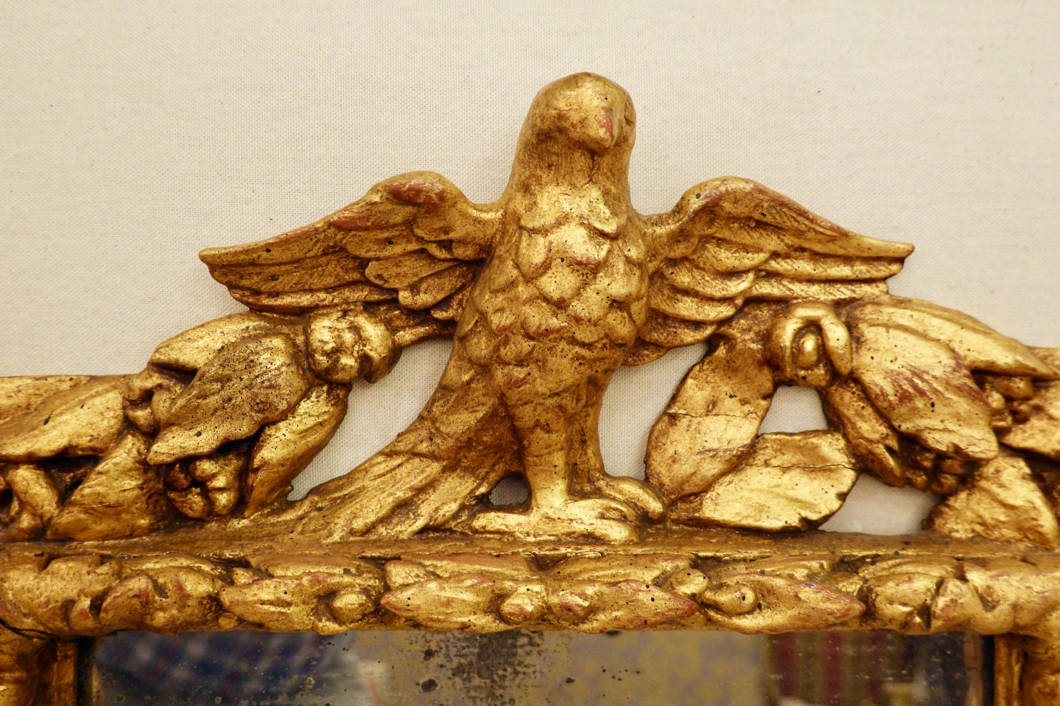 Gold Leaf 18th Century Carved Giltwood Mirror with Eagle, Roses and Leaves For Sale